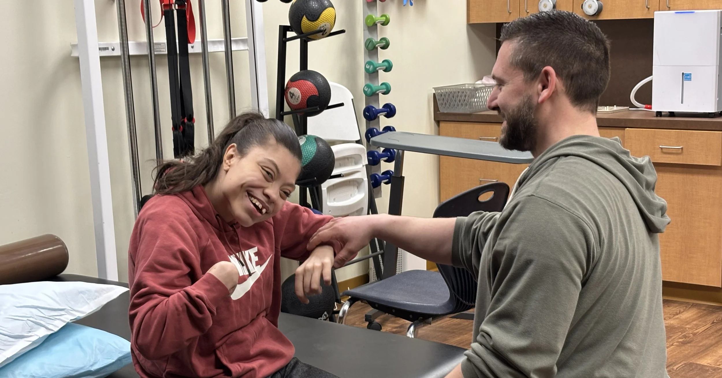 Physical therapist at The Arc Erie County New York with a patient
