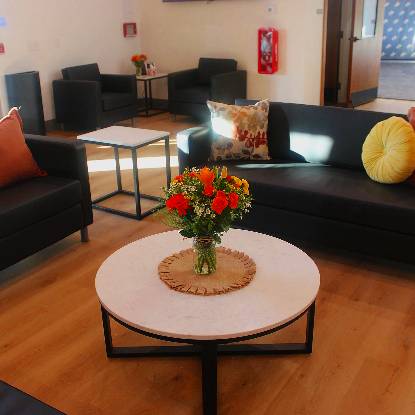 decorated table with fresh flowers in Black Water Acres' front lobby