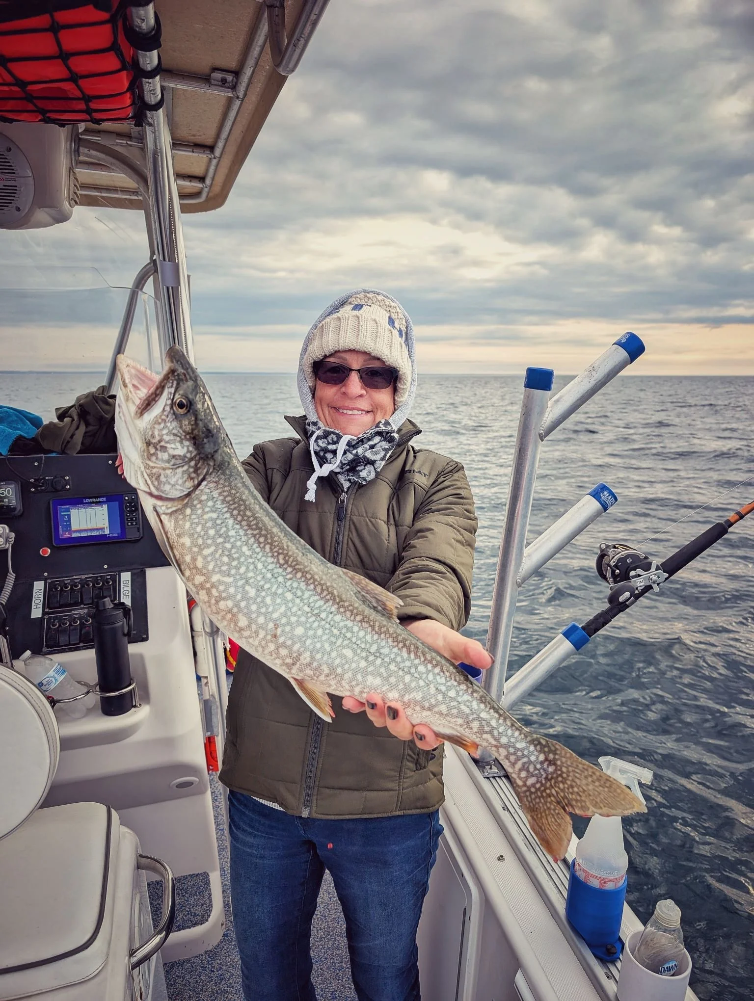  An angler showcasing a solid Lake Trout caught on Lake Huron near Drummond Island during a Reel Fish'n LLC fall charter in October.   