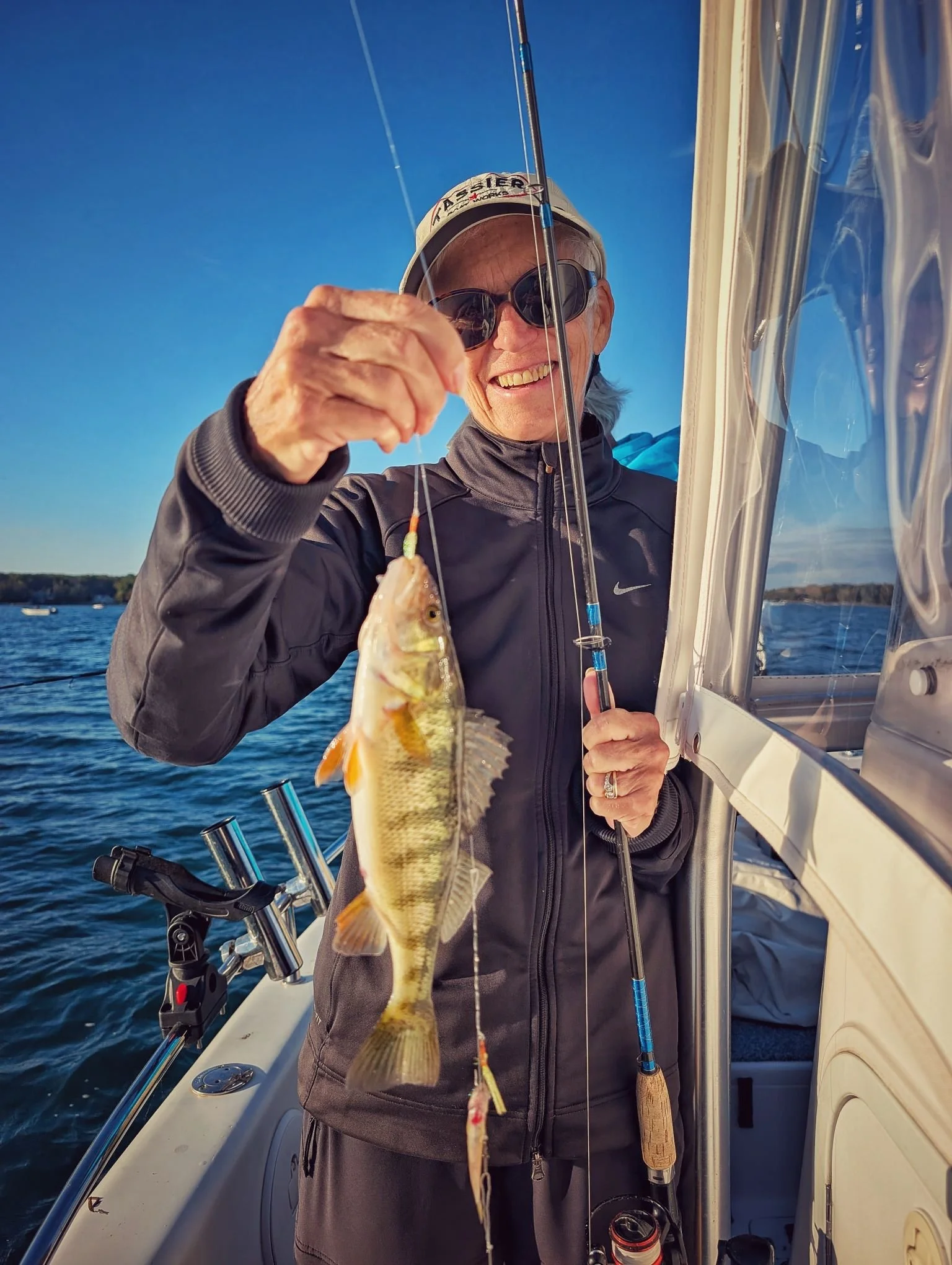  An angler showcasing a great "eater" yellow perch caught on a crisp fall day at Drummond Island with Reel Fish'n LLC.   