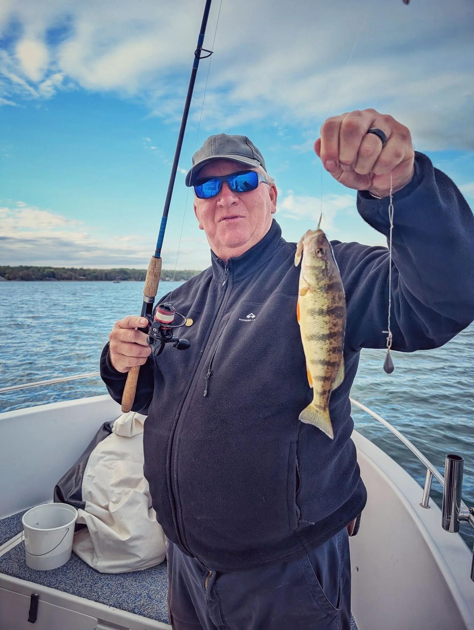  An angler holding a double header of yellow perch caught during a crisp fall day on Drummond Island with Reel Fish'n, launching from Drummond Island Yacht Haven. 