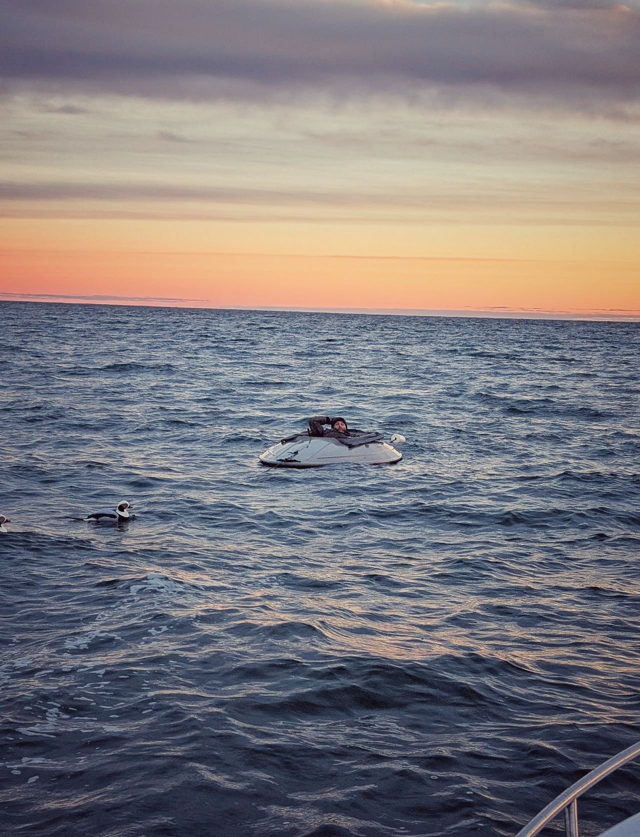  A Next Gen Kalash layout boat disappearing into the Lake Huron sunrise, providing the ultimate low-profile concealment for hunting wary sea ducks like Longtails and Old Squaws.   