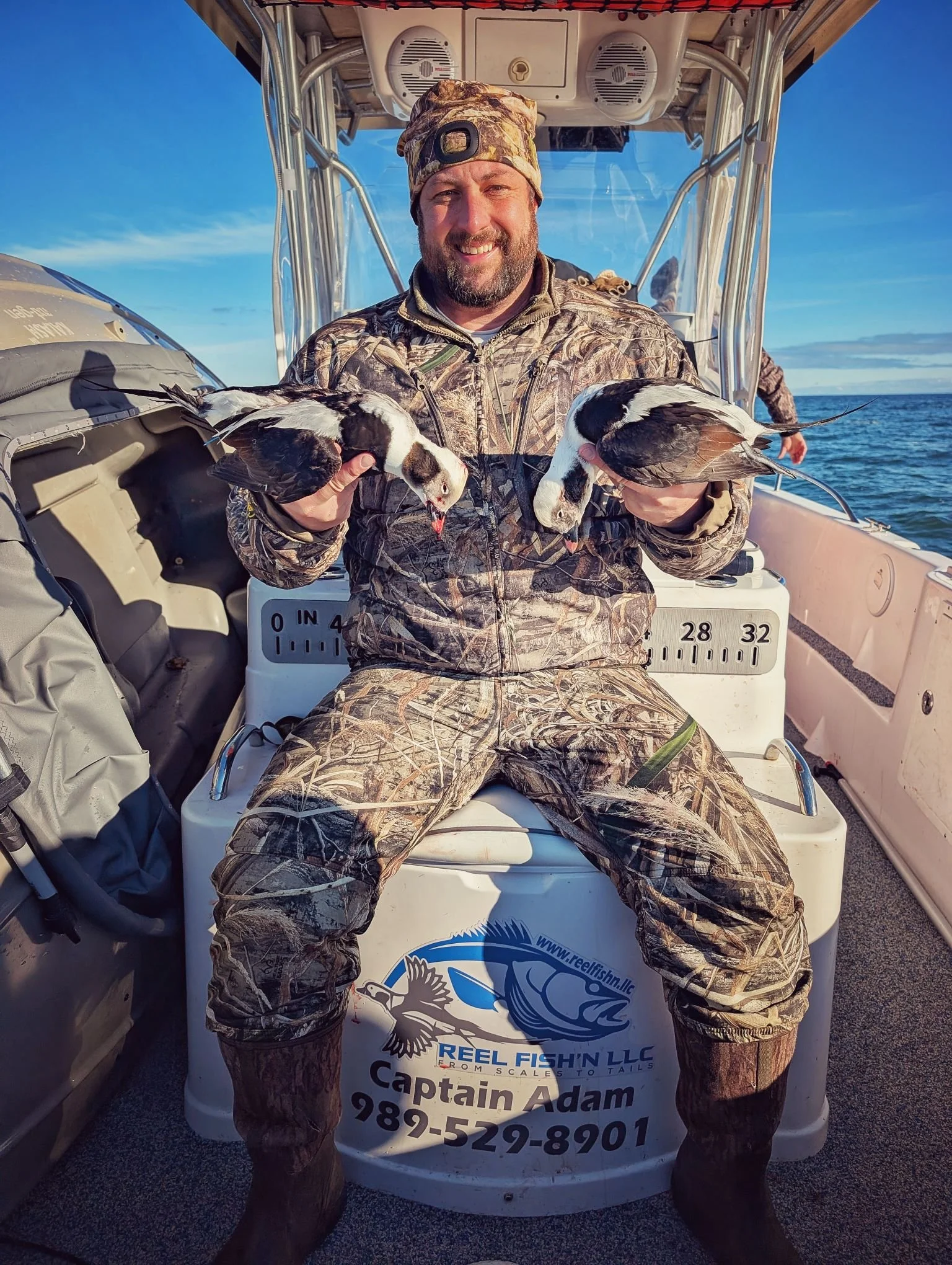  A waterfowler showcasing a prime, mature Longtail (Old Squaw) harvested during a guided sea duck hunt on Saginaw Bay; a true bucket-list trophy bird.   
