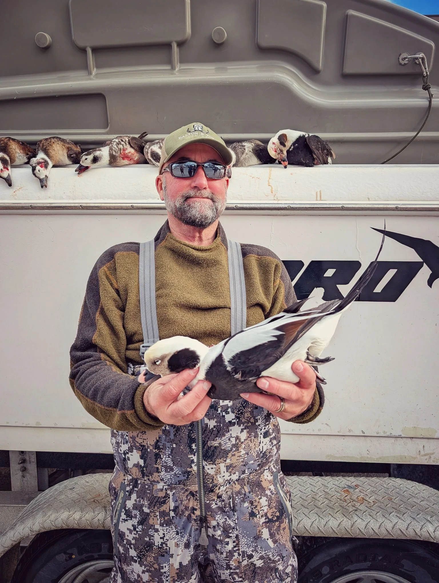  A hunter displaying a mature Longtail (Old Squaw) shot during a guided layout boat hunt on Lake Huron; notice the incredible tail length on this trophy sea duck.   