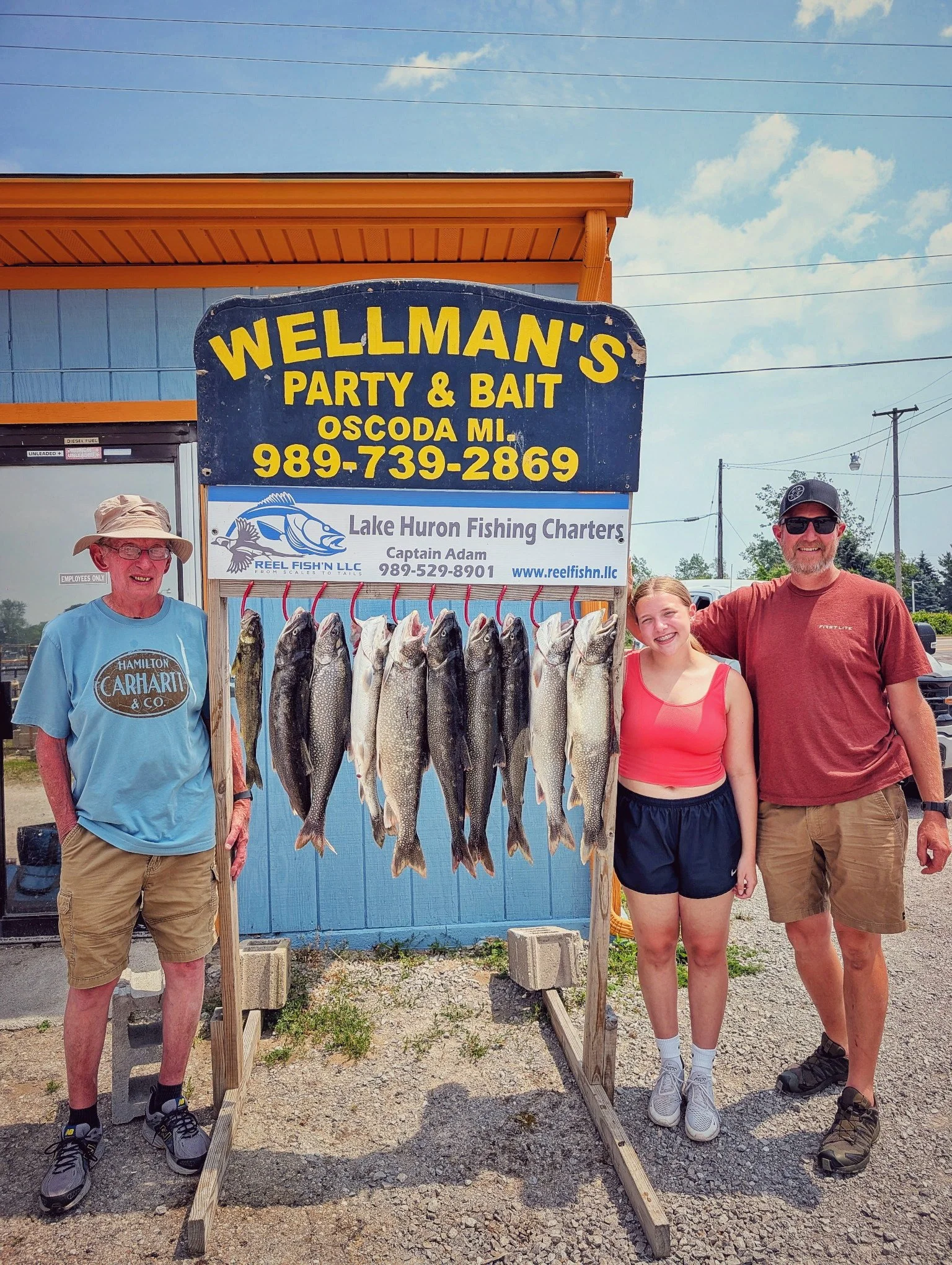 Reel Fish'n clients at Wellman's Party & Bait in Oscoda after a successful Lake Huron charter.