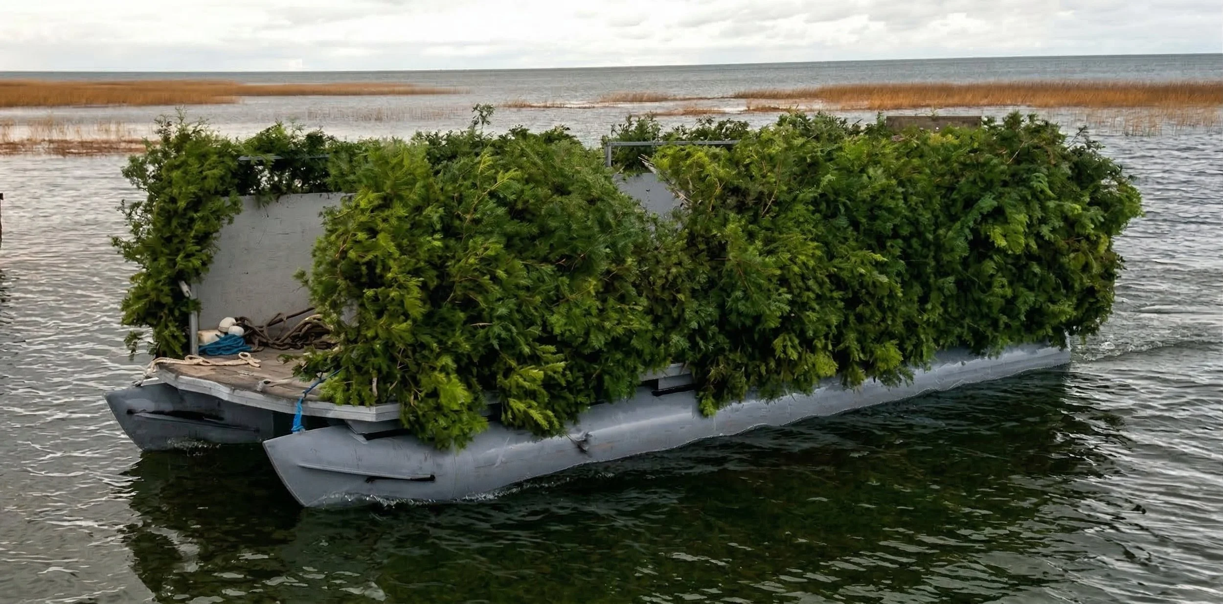 Captain Mark’s specialized duck hunting pontoon featuring an onboard kitchen for 100% open water layout duck hunts on Saginaw Bay.