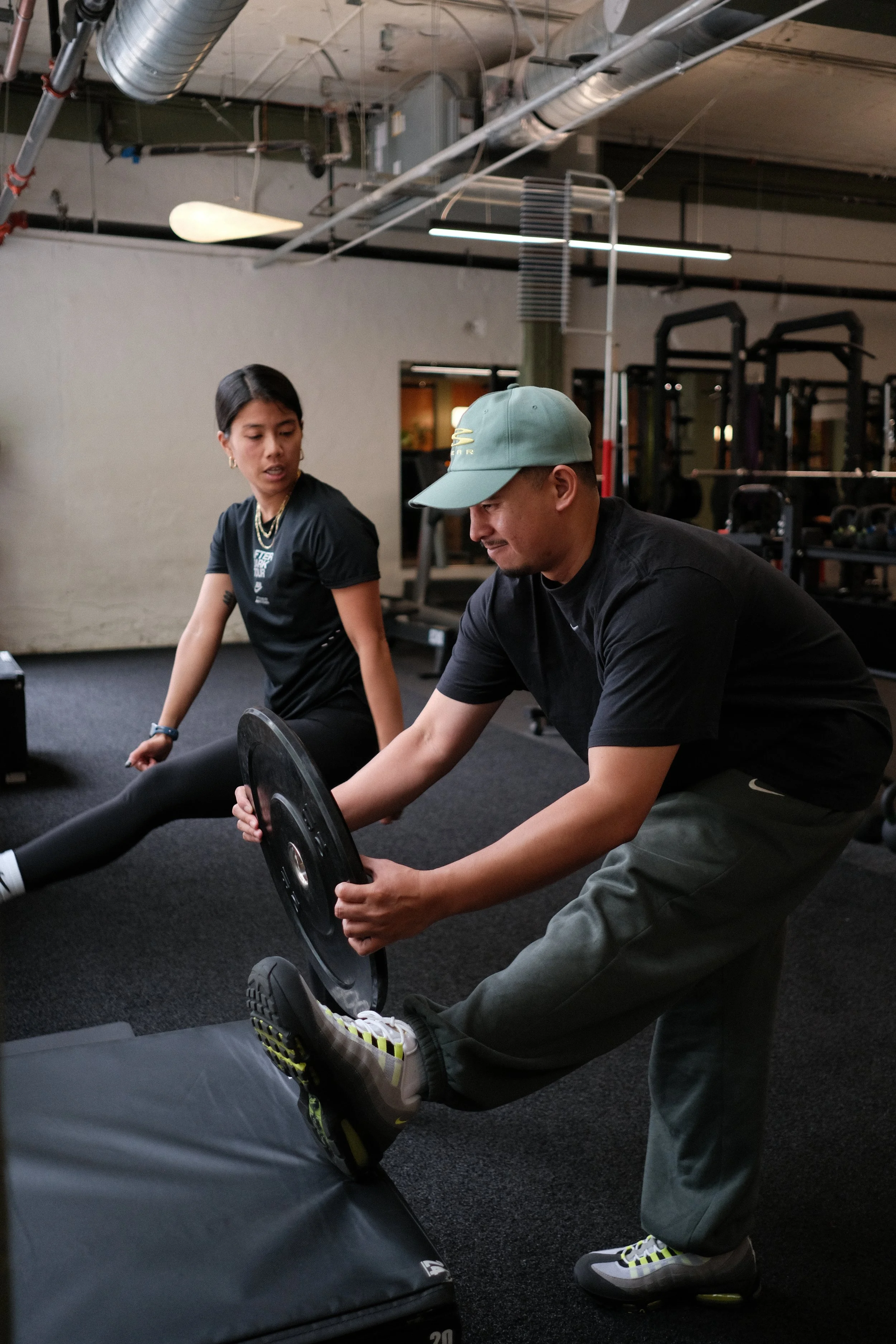 athlete performing strength and conditioning exercises independently in a gym setting
