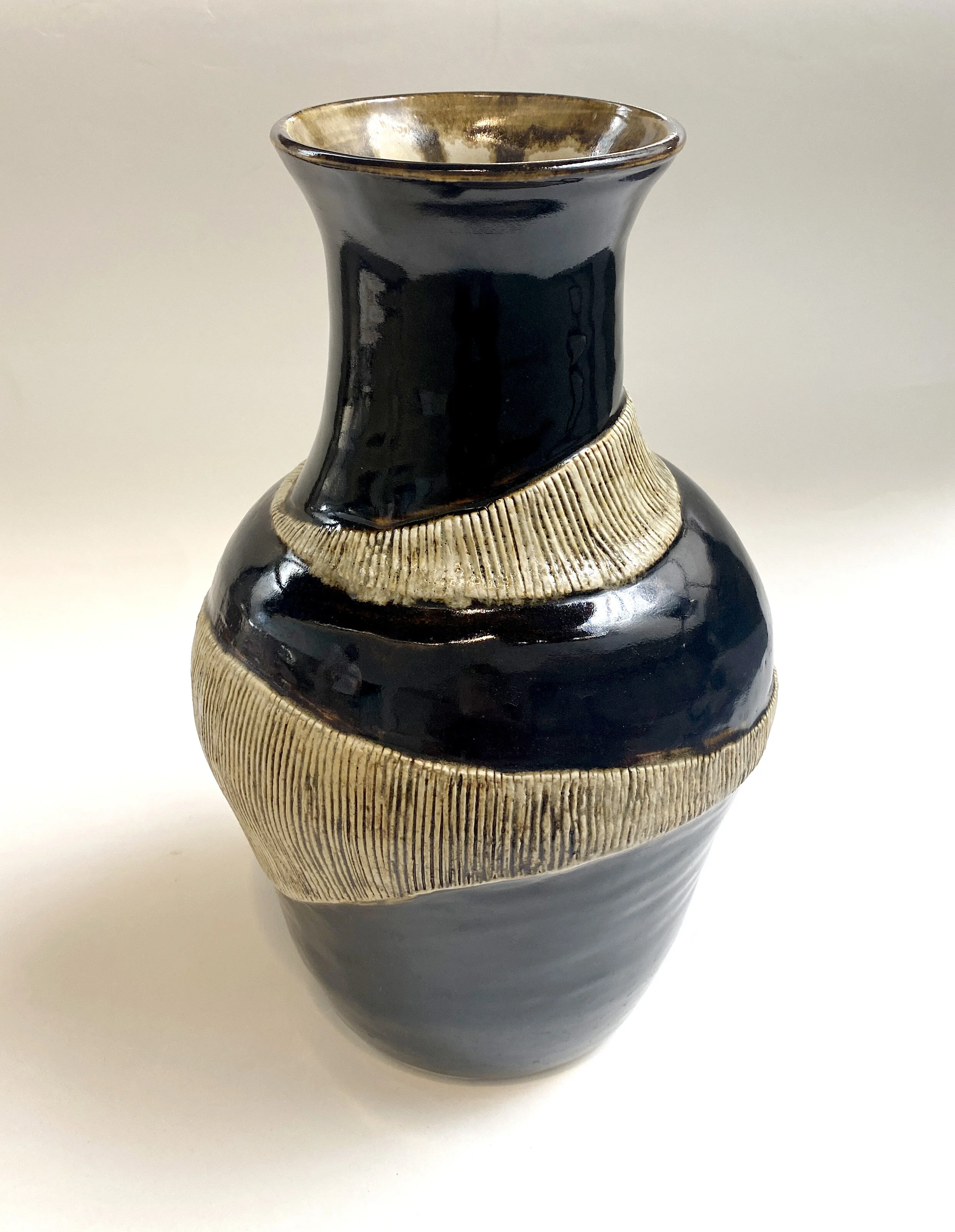 “Loosely Wrapped” Clay Vase Brown/cream 16" tall X 6" diameter
Retail: $85
Opening Bid; $43