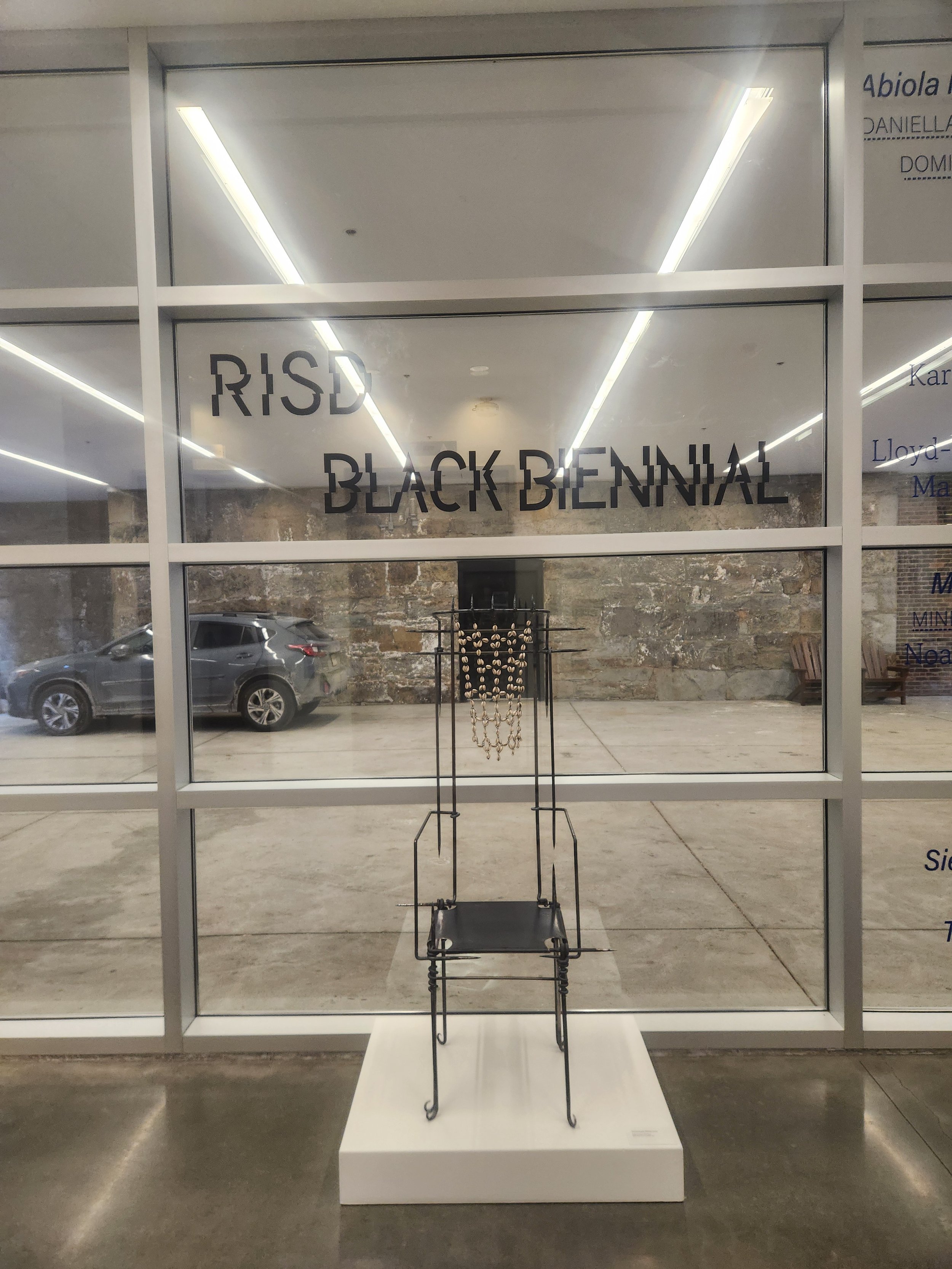 Final iteration of chair adorned with cowrie shells on show at the Black Biennial at RISD