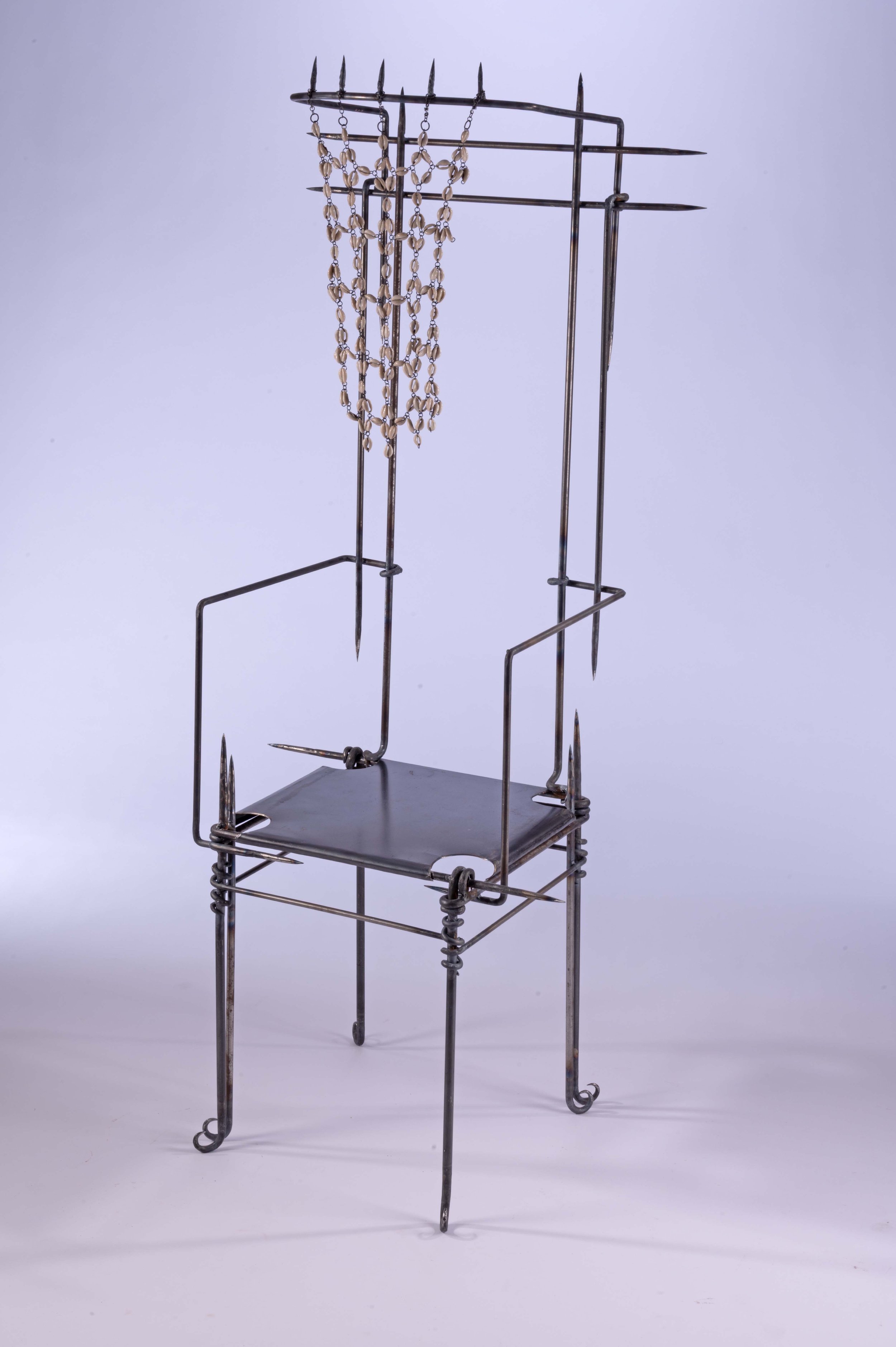 Adorning a Throne (A Veil of Cowries). 2025. Mild steel. Kenyan cowrie shells. Wax.