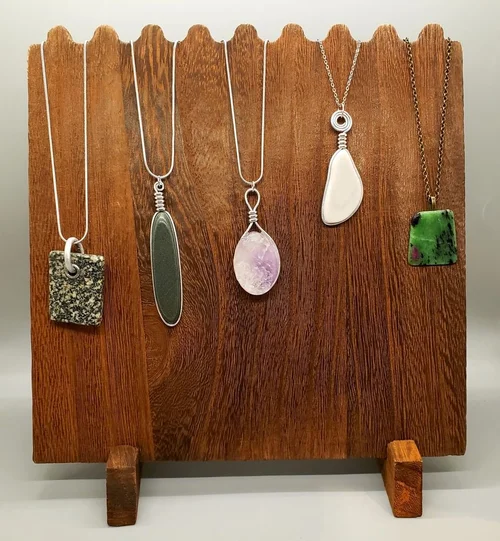 Pendants on a wooden display board
