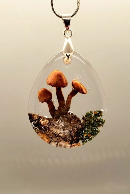 Resin pendant with tiny mushrooms