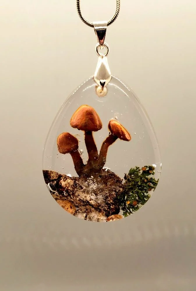 Resin pendant with tiny mushrooms