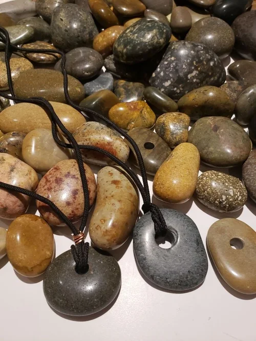 Drilled stones on cord