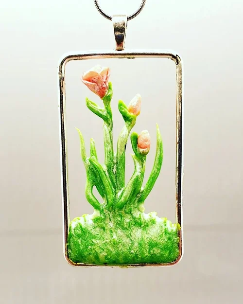 Resin pendant with sculpted flowers