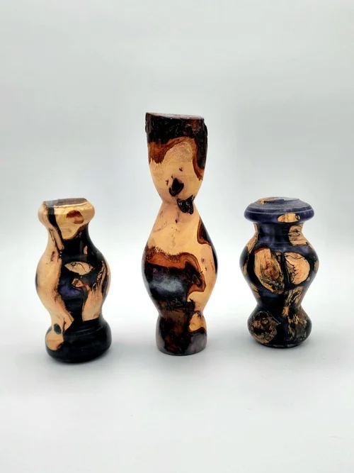 Three twisted wood vases
