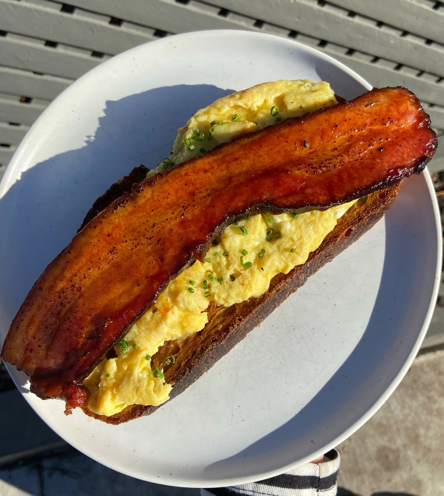 Pork Belly + Eggs is back! 🐷💥 Smoked pork belly with gochujang BBQ sauce, soft scrambled eggs + chives on our sourdough toast! Available ALL DAY tomorrow so don&rsquo;t miss it!!! ✨✨✨

#porkbelly #sourdough #brunch #torontofood #yyzeats