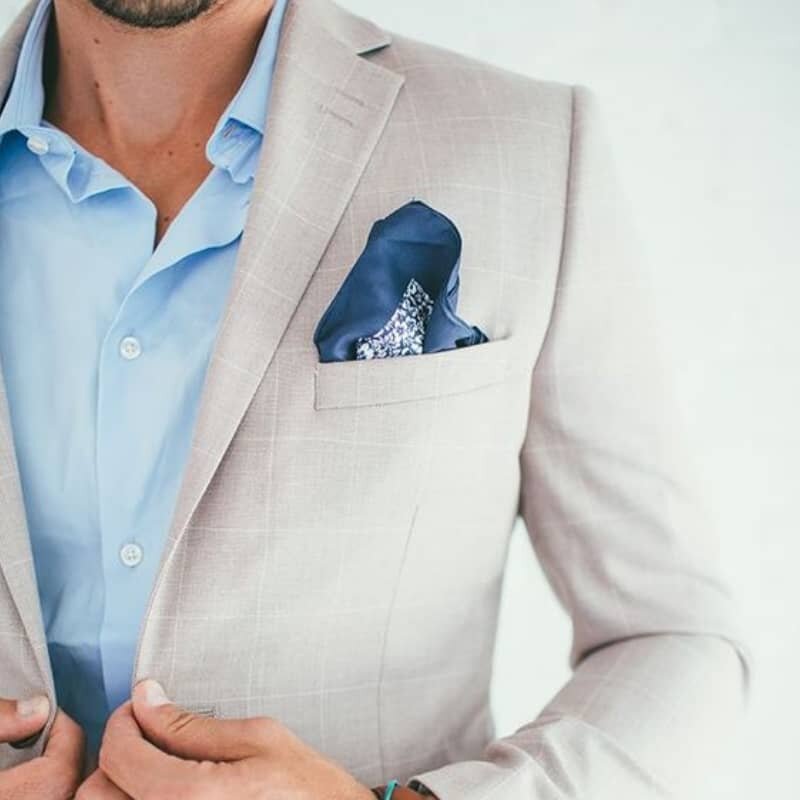 smart men's style in blazer with blue shirt and pocket square