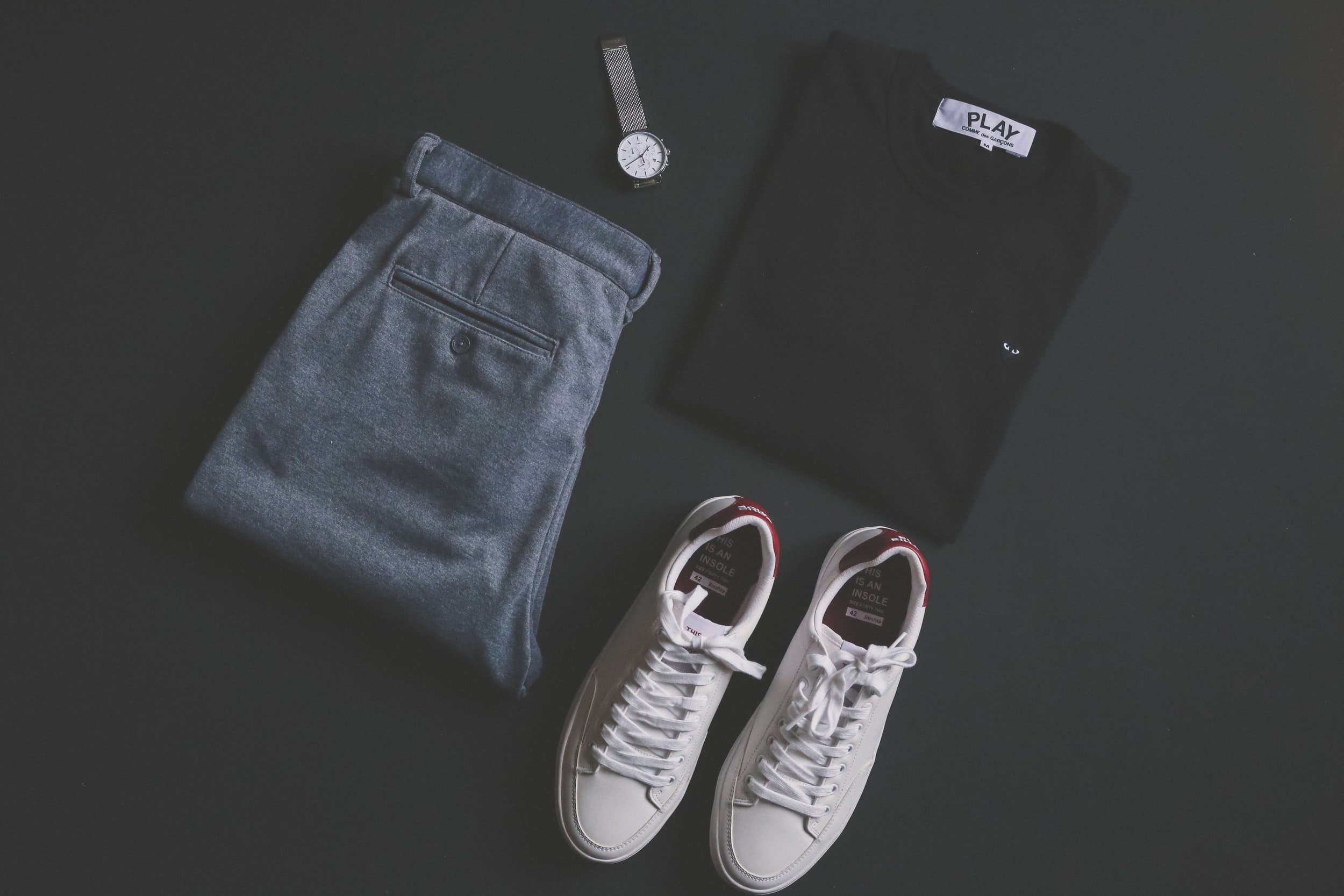mens core wardrobe for summer with trousers, sneakers, t-shirt and watch