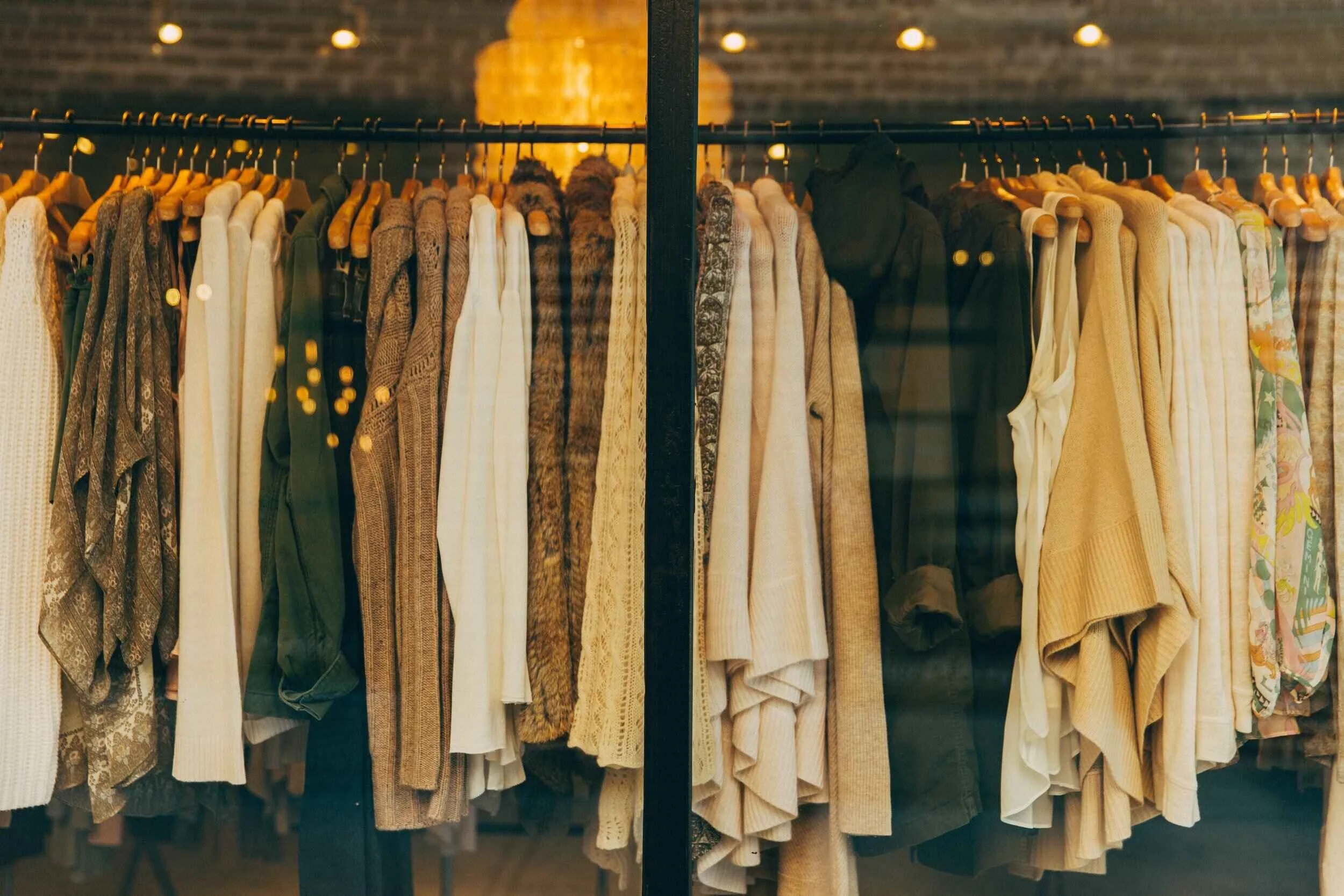 rack of womens clothing in a sydney store in neutral colours