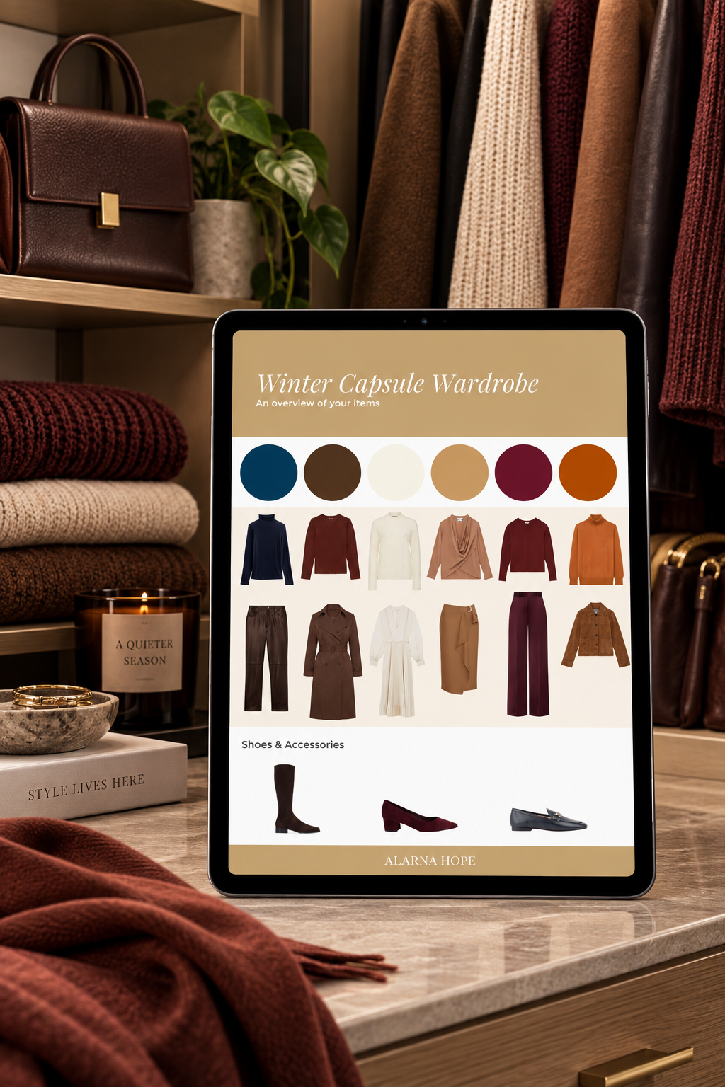 Personalised women’s winter capsule wardrobe displayed on a tablet in a wardrobe with coordinated clothing, shoes and accessories.