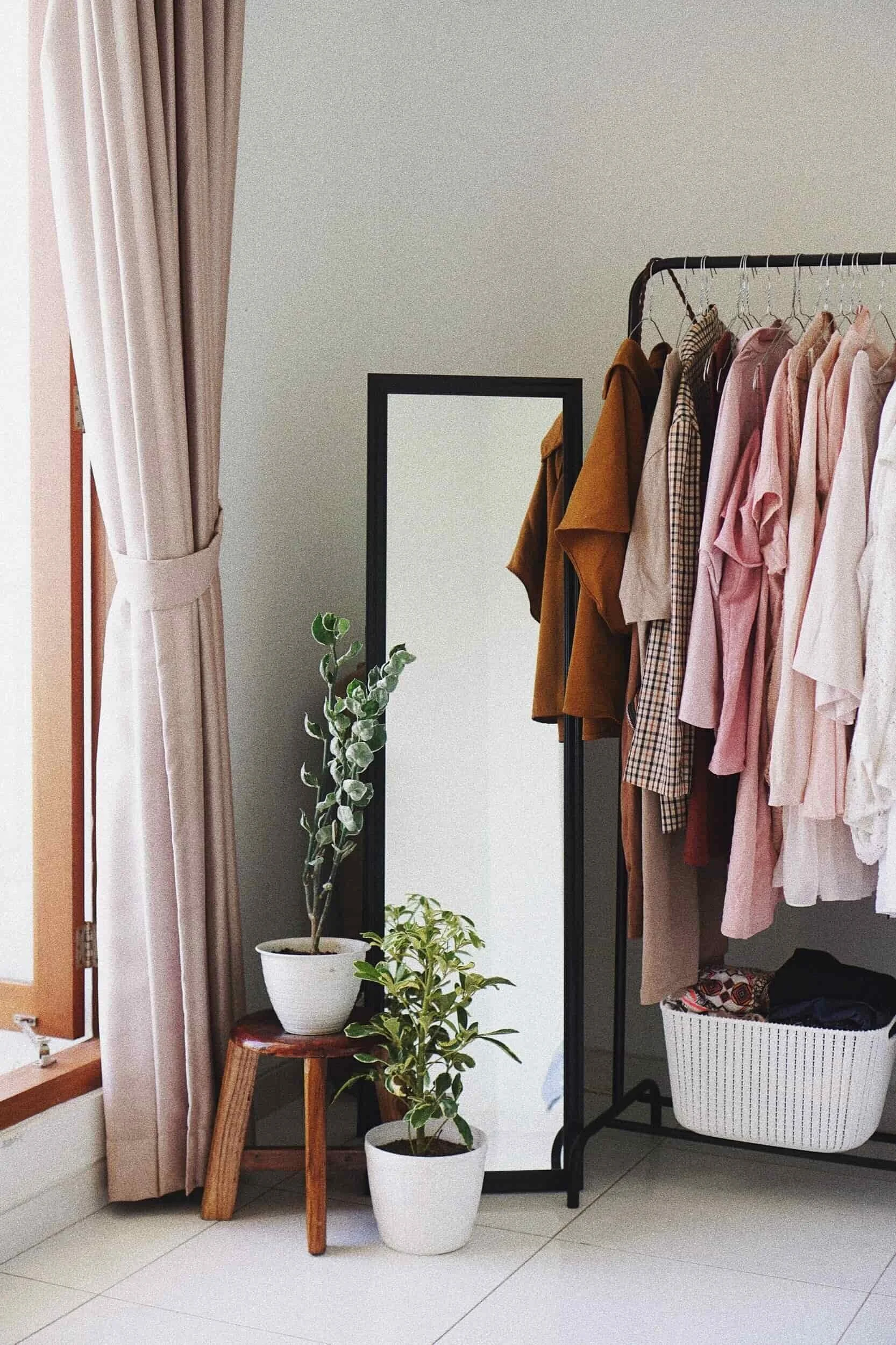 rack of womens clothing in stylist fitting room in Sydney