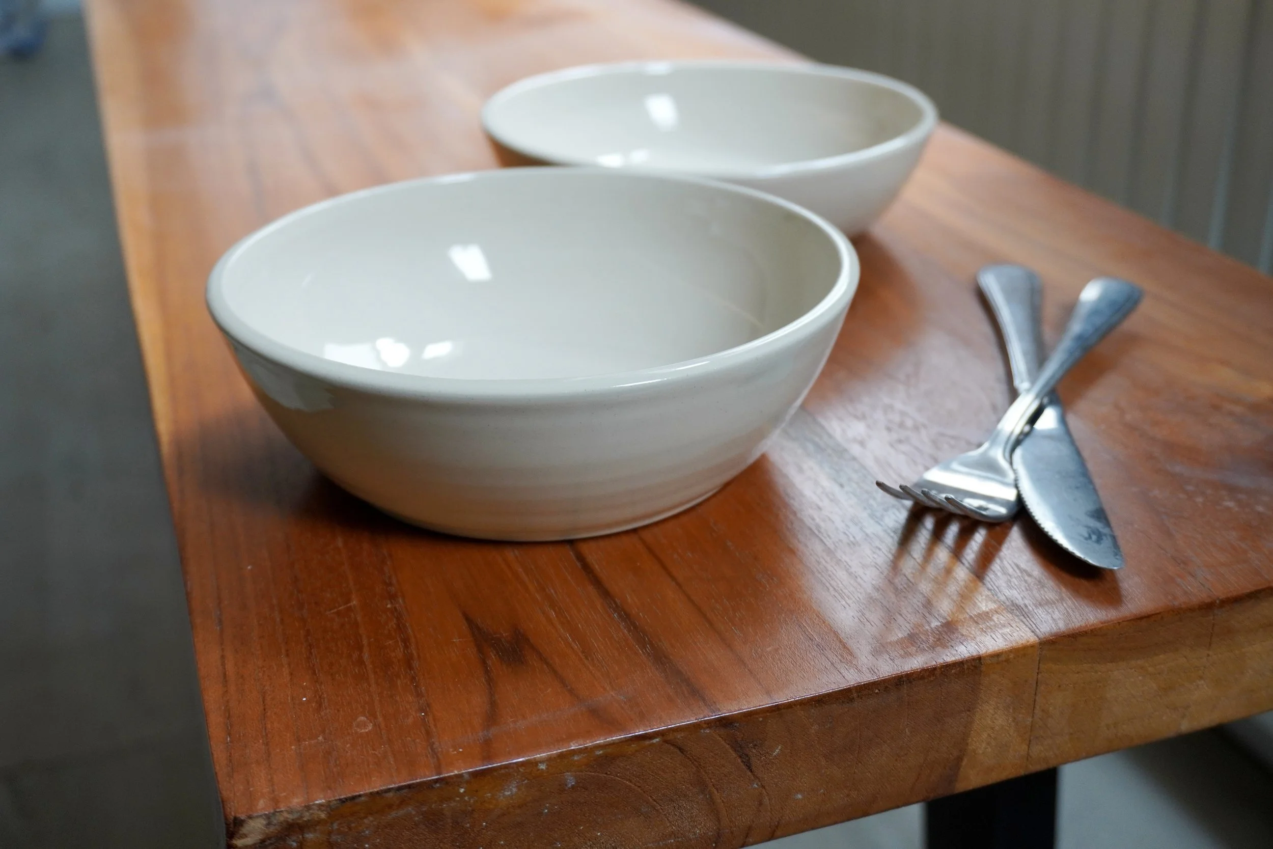 Each bowl has been hand thrown from white stoneware clay