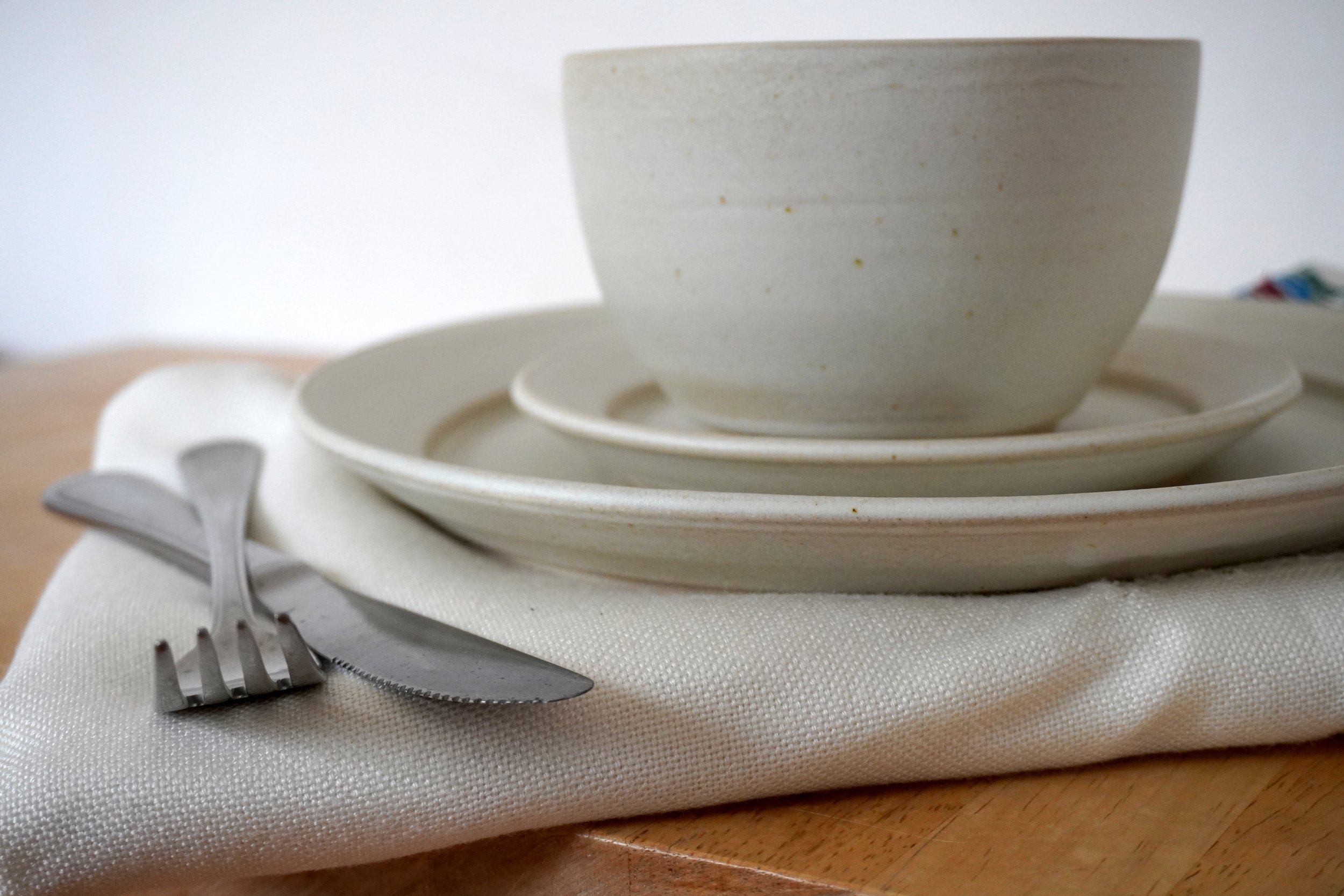 A close up detail of the plate set