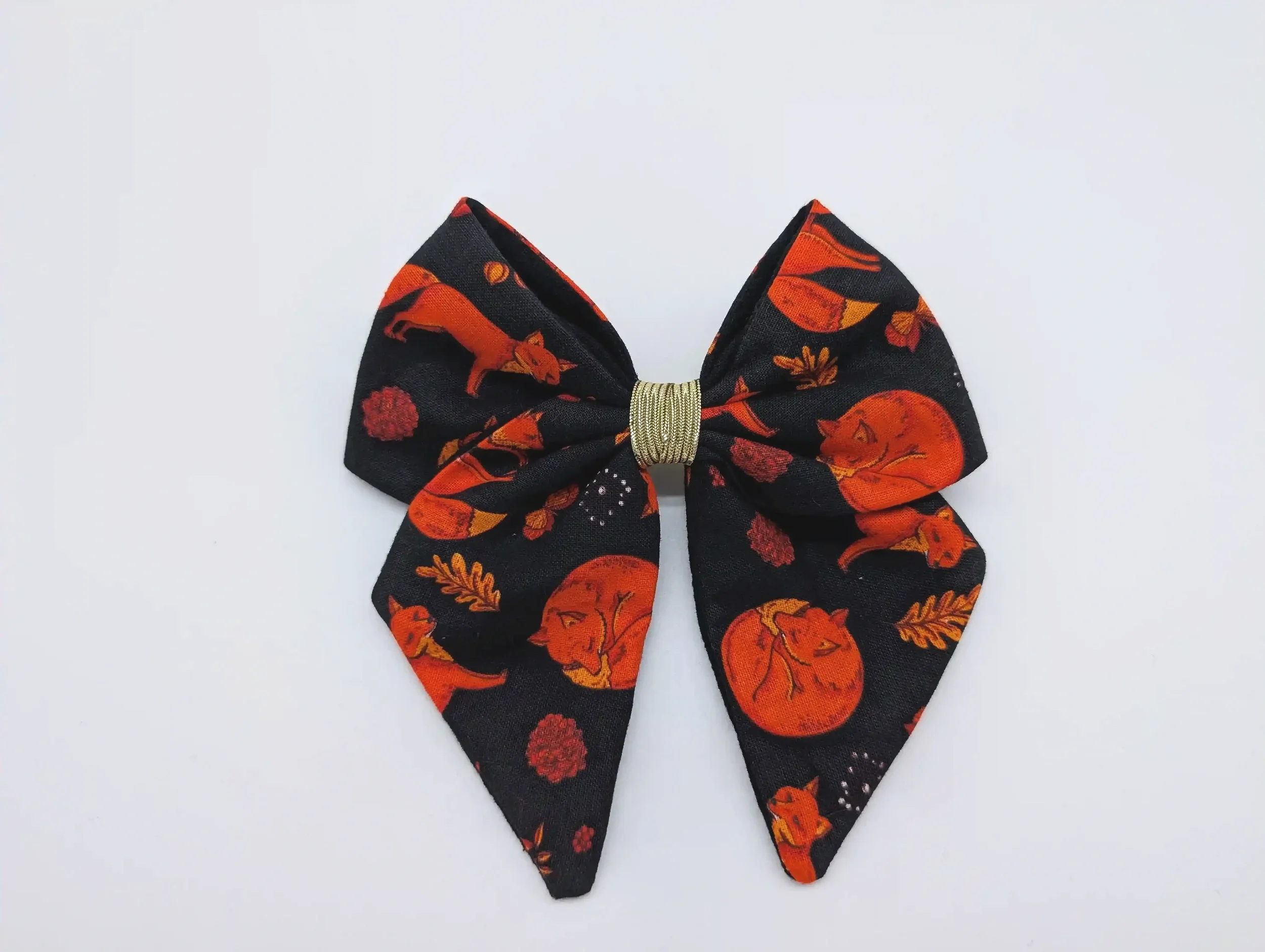 Petit nœud pour cheveux Renards taille S, en coton noir à renards roux, feuilles d’automne et centre doré.