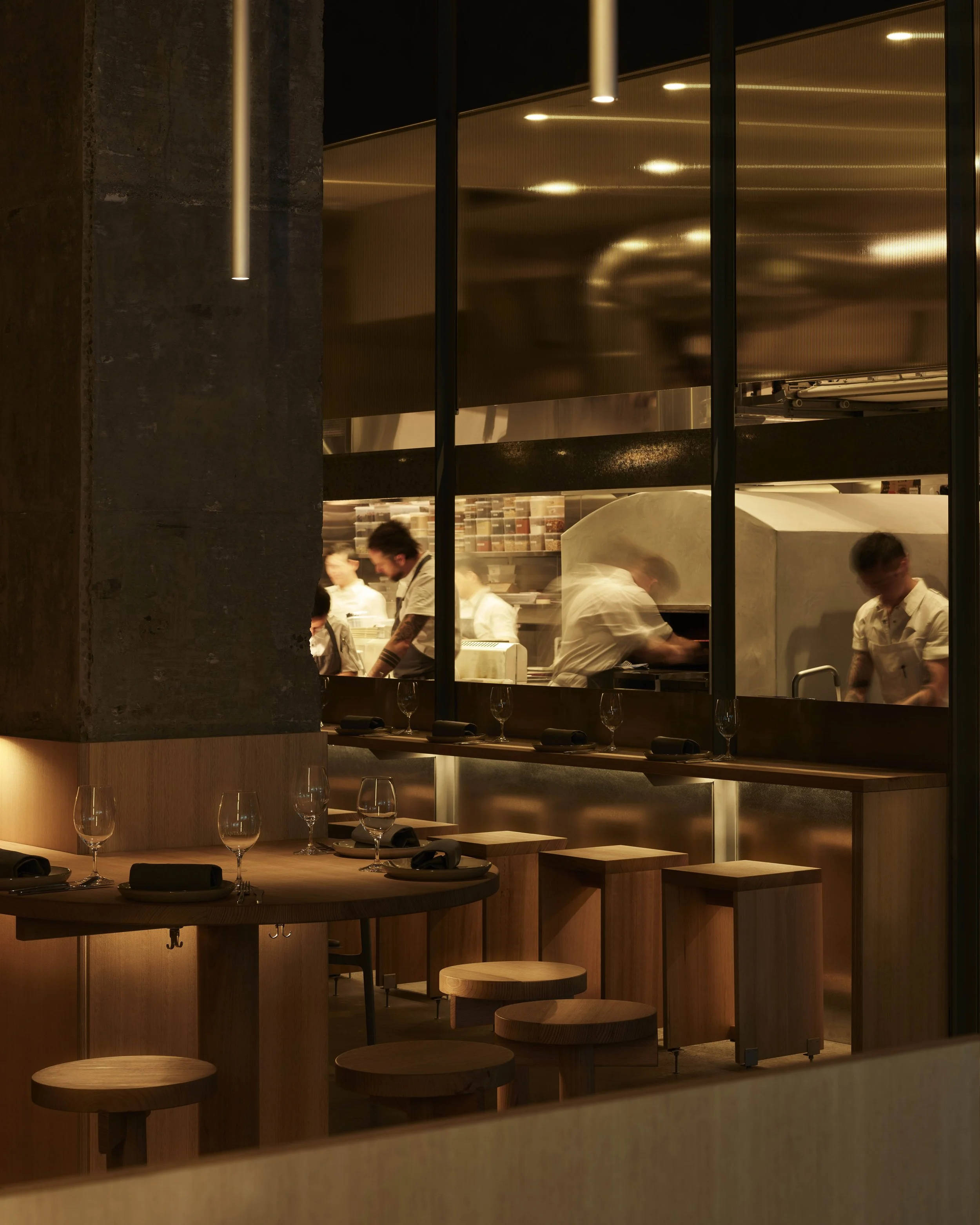 Interior view of Antara - Melbourne, a wood fired Restaurant, Bar & Bakery, showcasing custom designed By Dave solid VIC Ash stools.