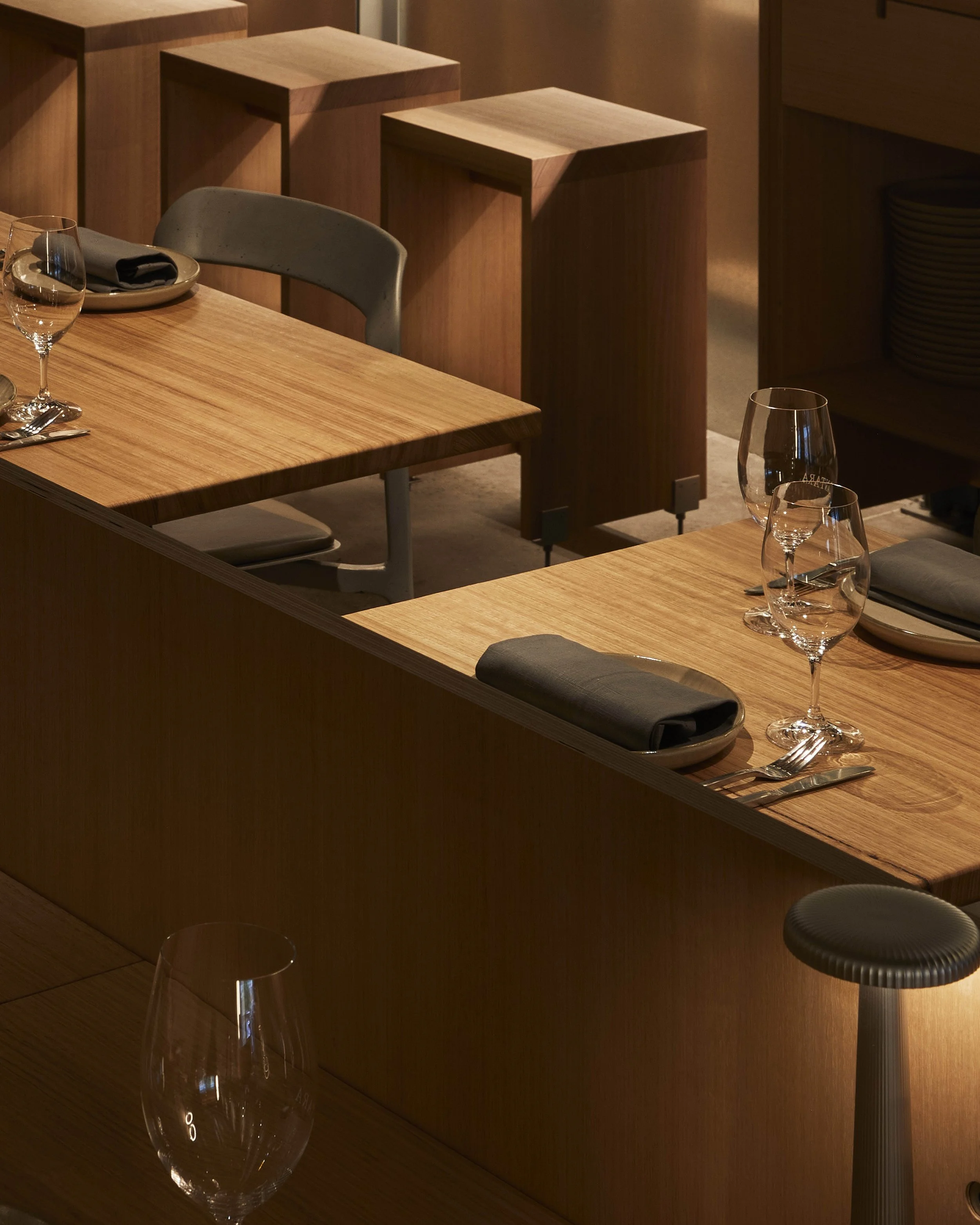 Interior view inside Antara - Melbourne, a wood fired Restaurant, Bar & Bakery. By Dave custom designed and stools featuring in the foreground.