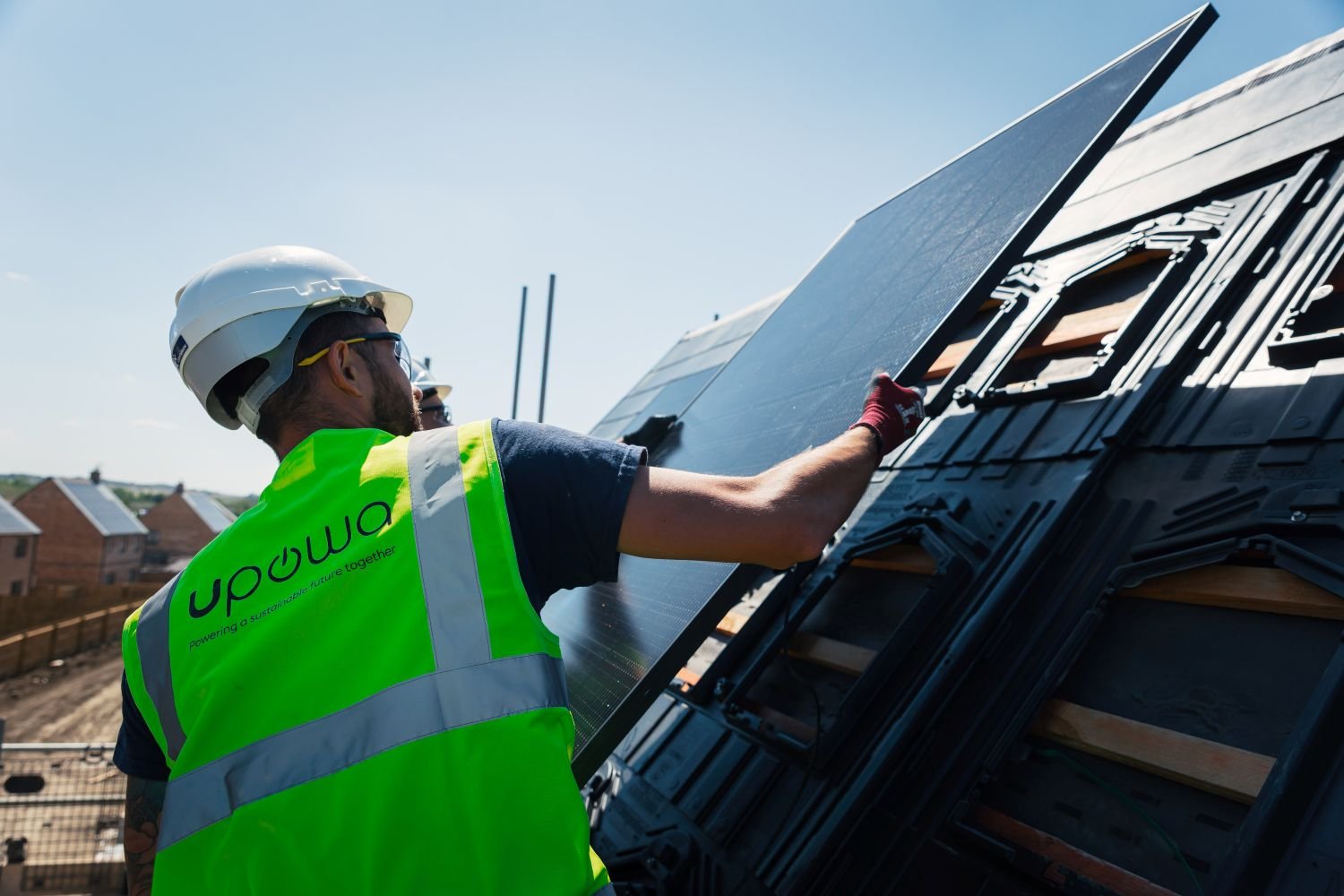 UPOWA solar PV installer fitting solar panels on a new build home