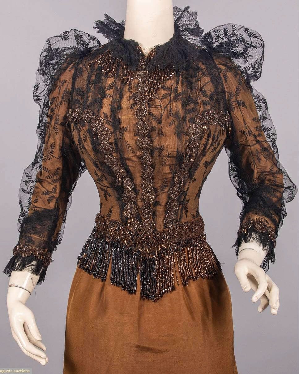 🌰 Nutmeg wool &amp; silk blend dinner dress, early 1890s, maker unknown, Augusta Auctions

Silk tulle overlay embroidered with metallic iridescent beading and black beaded fringe, with black chantilly lace collar ruff.
.
.
.
.
.
.
.
.
.
.
#1890s #gi