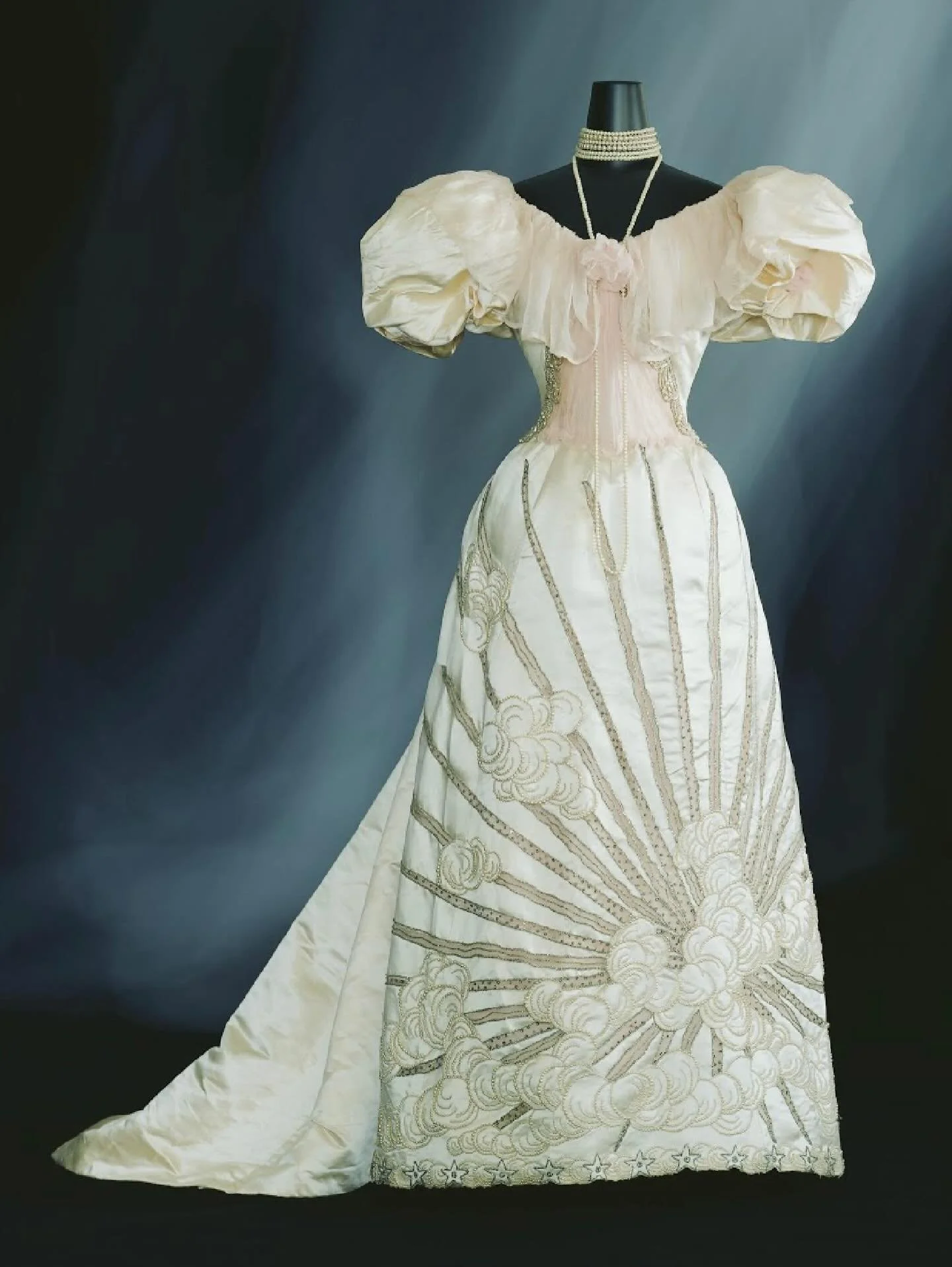 ☁️ &ldquo;The clean line of the long skirt and the puffy sleeves were a typical look around 1895. The bold sunray and cloud pattern on the skirt is asymmetrical, a common feature of Japanese art and craft.

During the late 19th Century, the age of Ja