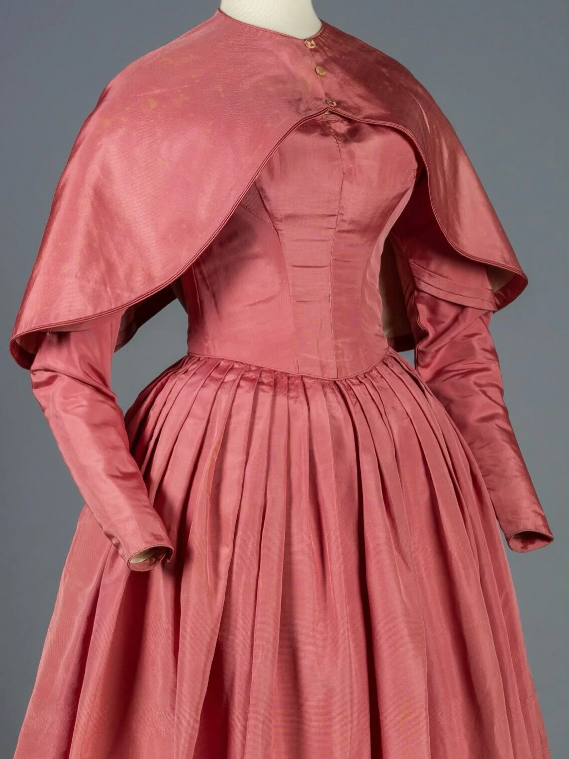 🩷 1840s silk faille dress with matching cape. &ldquo;Originally constructed in the 1830s and then altered in the 1840s. Alterations include lengthening the skirt and adding padding in the bodice&rsquo;s back to disguise the unknown wearer&rsquo;s sc