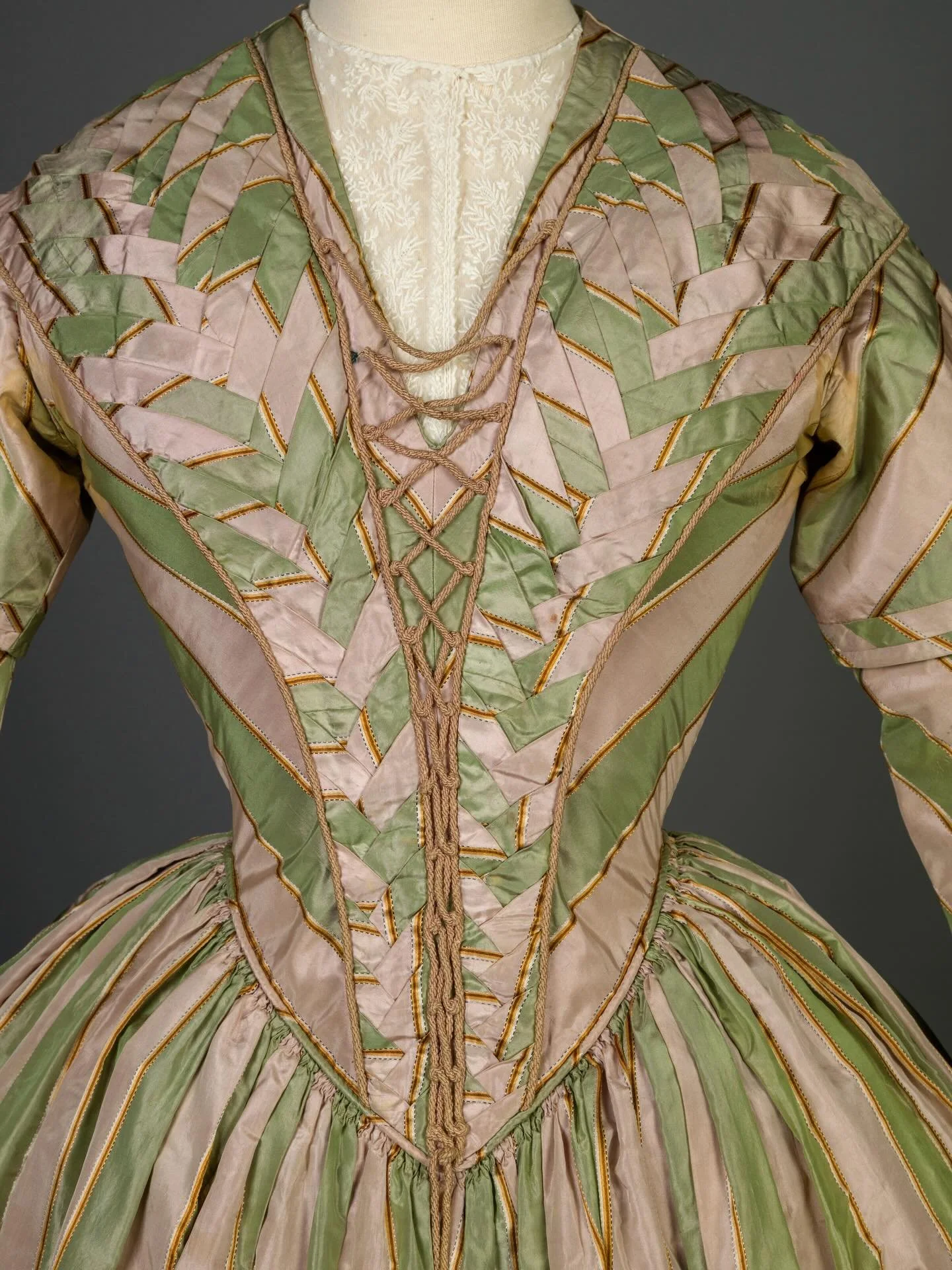 🍏 &ldquo;Fashions of the 1840s characteristically favored more subtle and subdued silhouettes, yet the meticulous manipulation of fabrics and patterns maximized a dress&rsquo;s visual interest. This pale green and lilac striped dress showcases the m