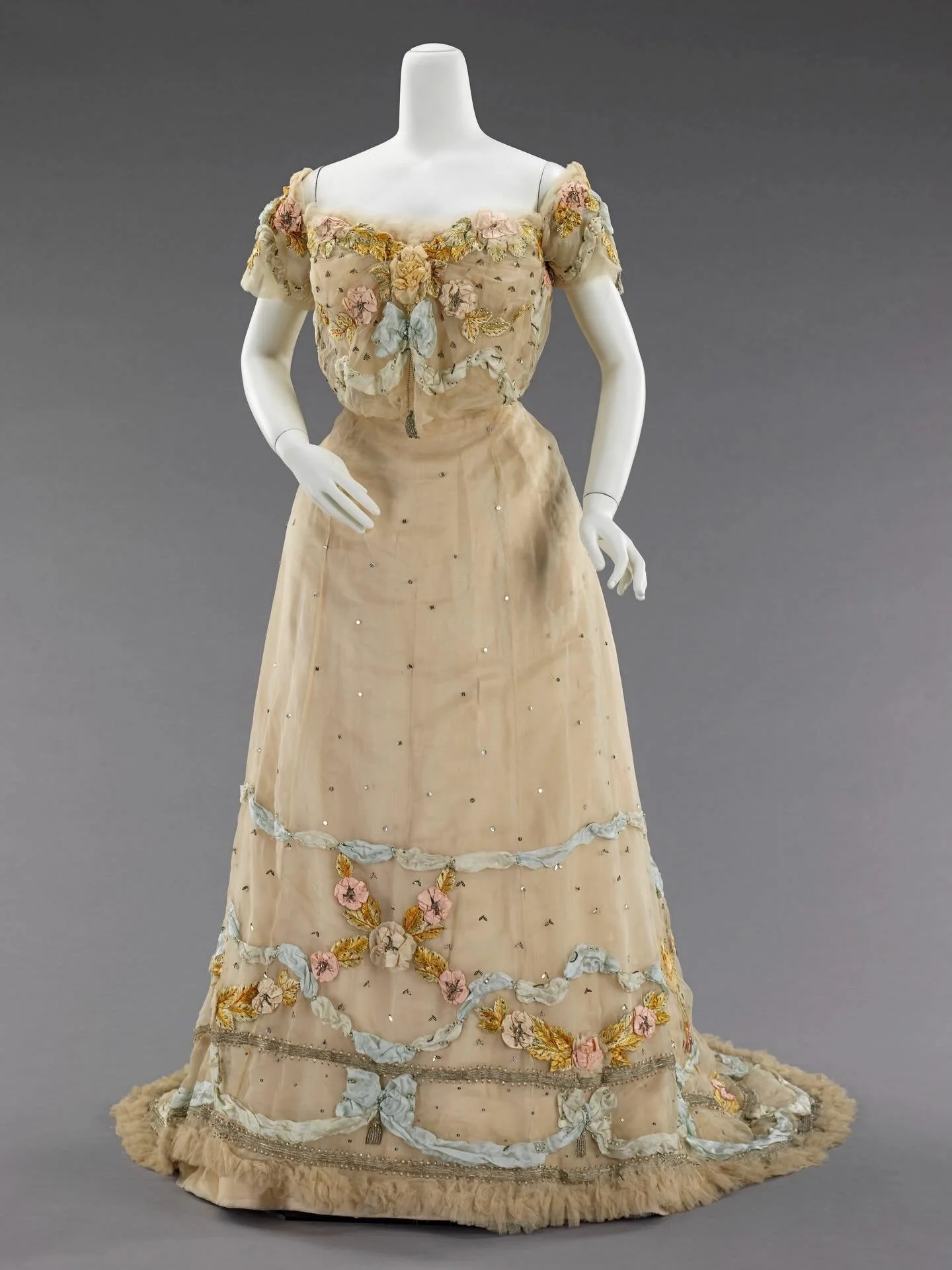 🐝 &ldquo;This is an exquisite ball gown of the period that exemplifies the fine work produced by the French ateliers. The placement of the paillettes into bee forms is a particularly engaging aspect of the overall embroidery and design, accenting th