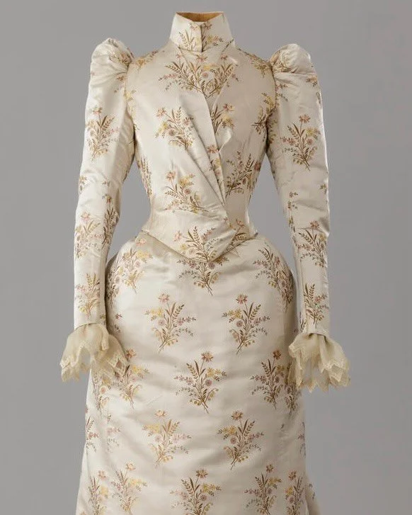 ⭐️ &ldquo;This two-piece formal ensemble consisting of a bodice and a skirt was made of an ecru-colored silk satin fabric with woven embroidered flowers. It is an elegant and striking example of the dresses worn by the &lsquo;high society&rsquo; at t