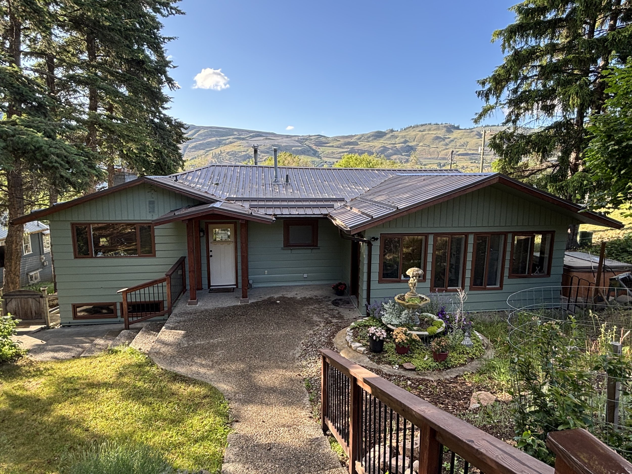 sage-green-exterior-painting-on-vernon-bc-ranch-home-with-okanagan-mountain-views