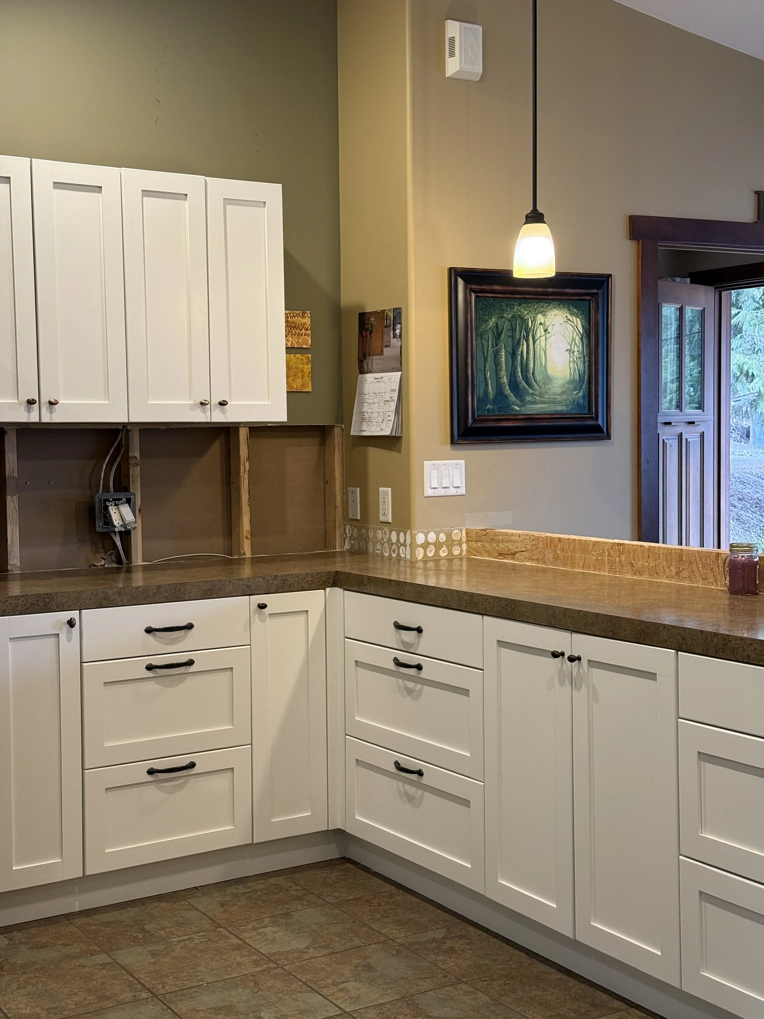 refinished-white-shaker-kitchen-cabinets-in-vernon-bc-home-by-third-generation-painters