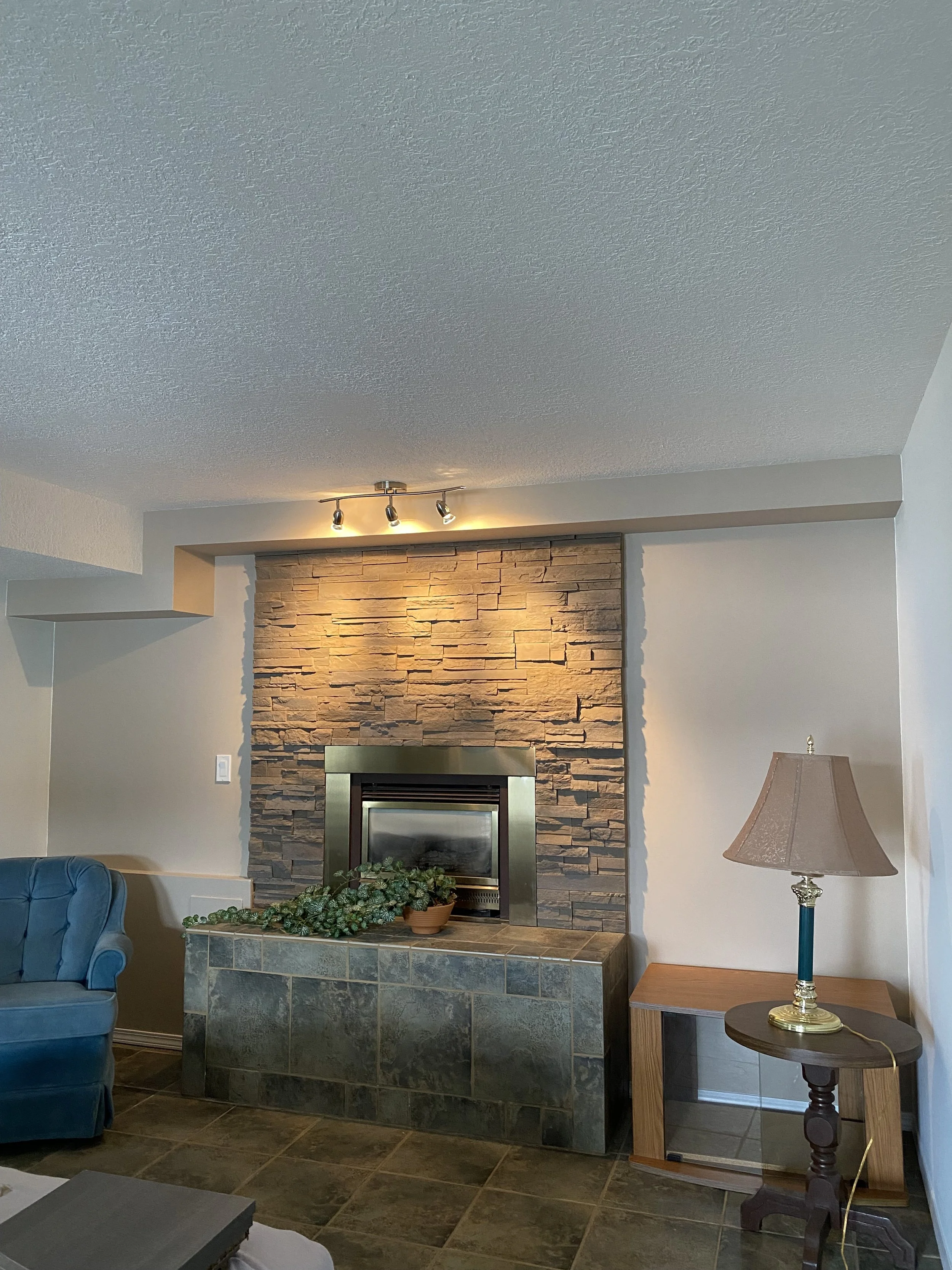 full-interior-repaint-with-shiplap-accent-wall-and-stone-fireplace-in-vernon-bc-home