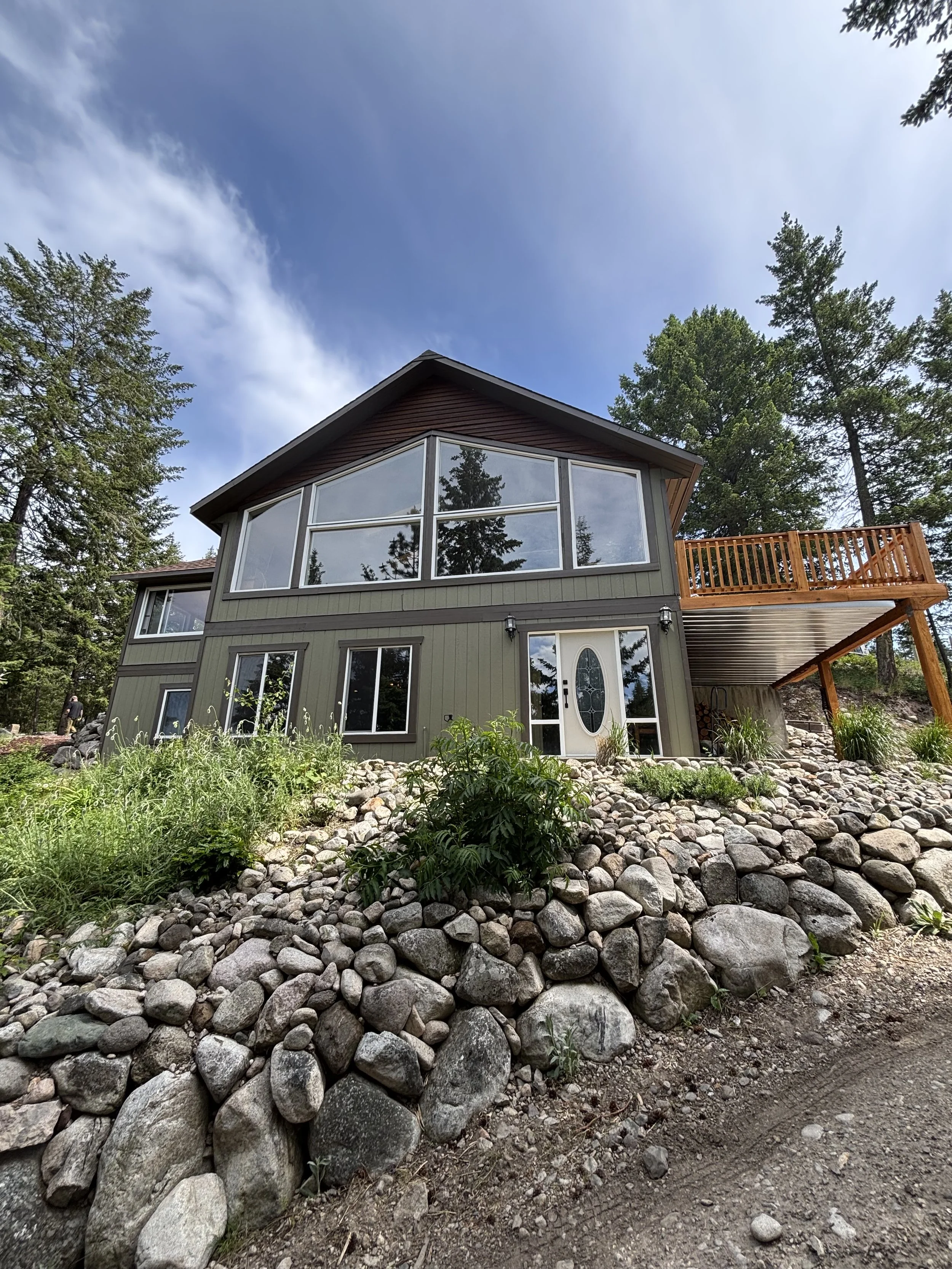 sage-green-exterior-painting-on-vernon-bc-home-with-large-picture-window