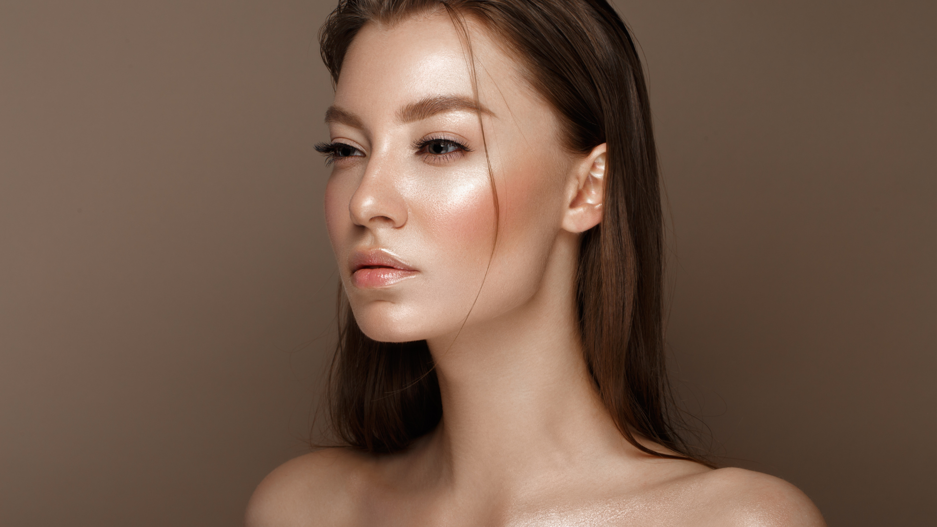 Image of young adult female showing bare face and shoulders