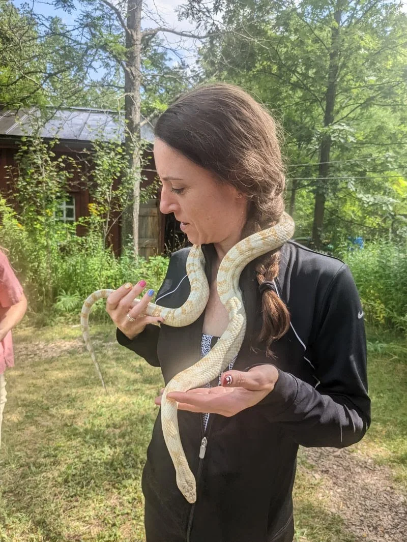 Moira holding a yellow snake