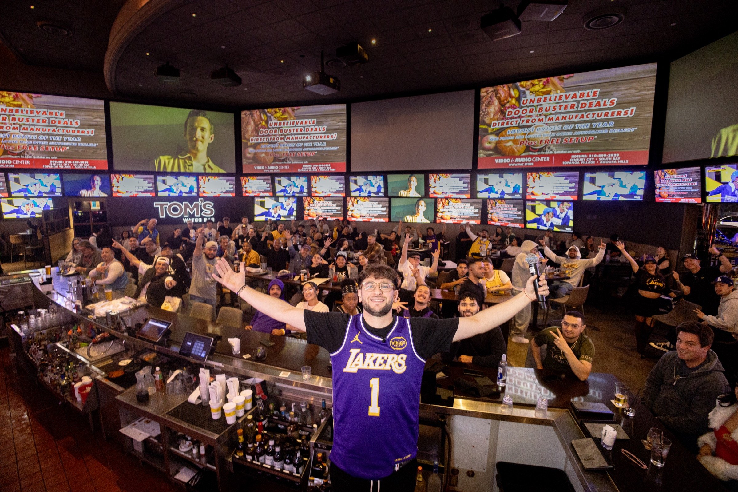 Aron Cohen hosting the LADE Lakers watch party with fans at Tom’s Watch Bar in Los Angeles.