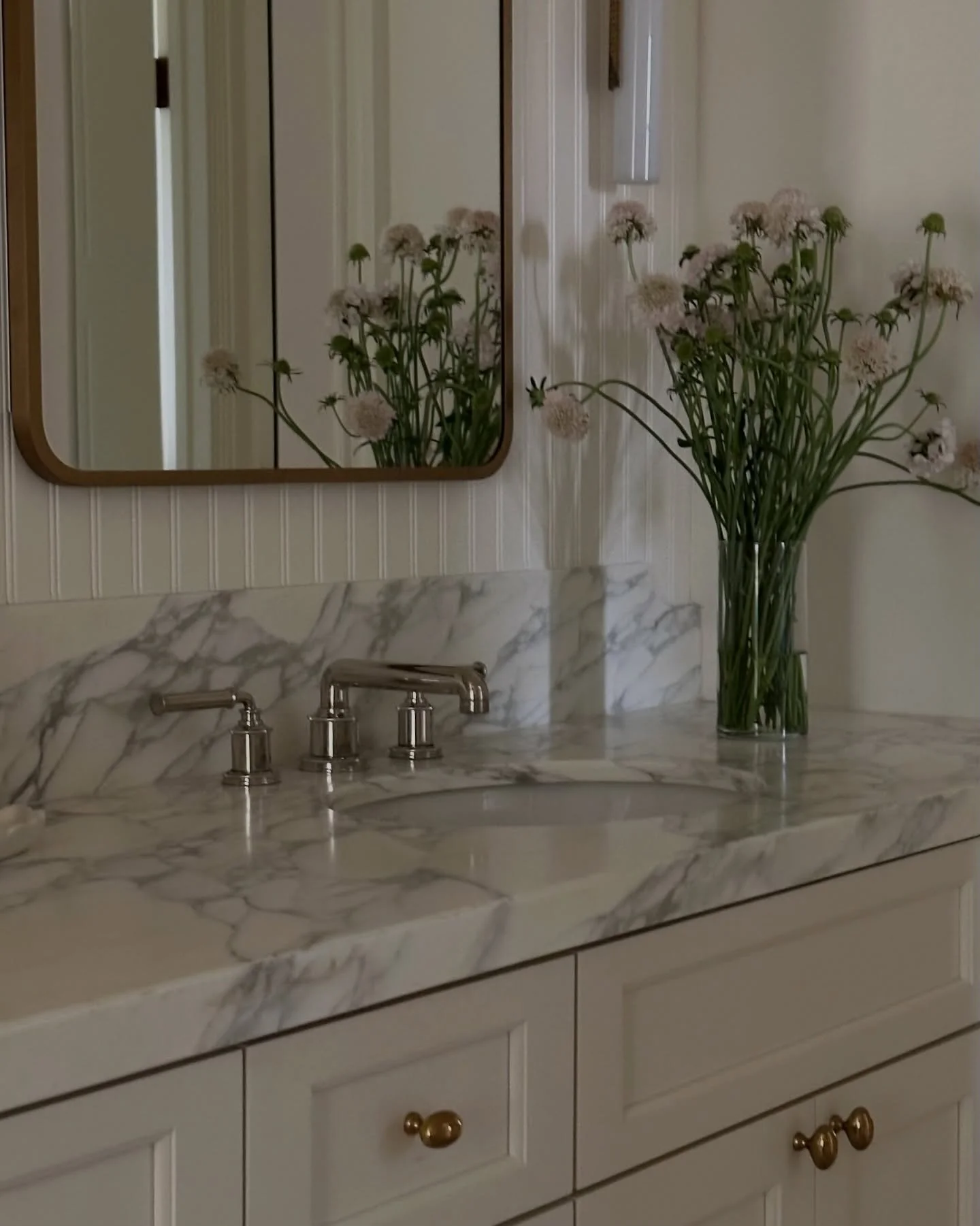 Design rule we swear by: When mixing metals, limit yourself to two.

Here we used polished nickel for all plumbing and brass for hardware + accent pieces. The result feels layered but cohesive and it&rsquo;ll age beautifully over time.

Try this for 