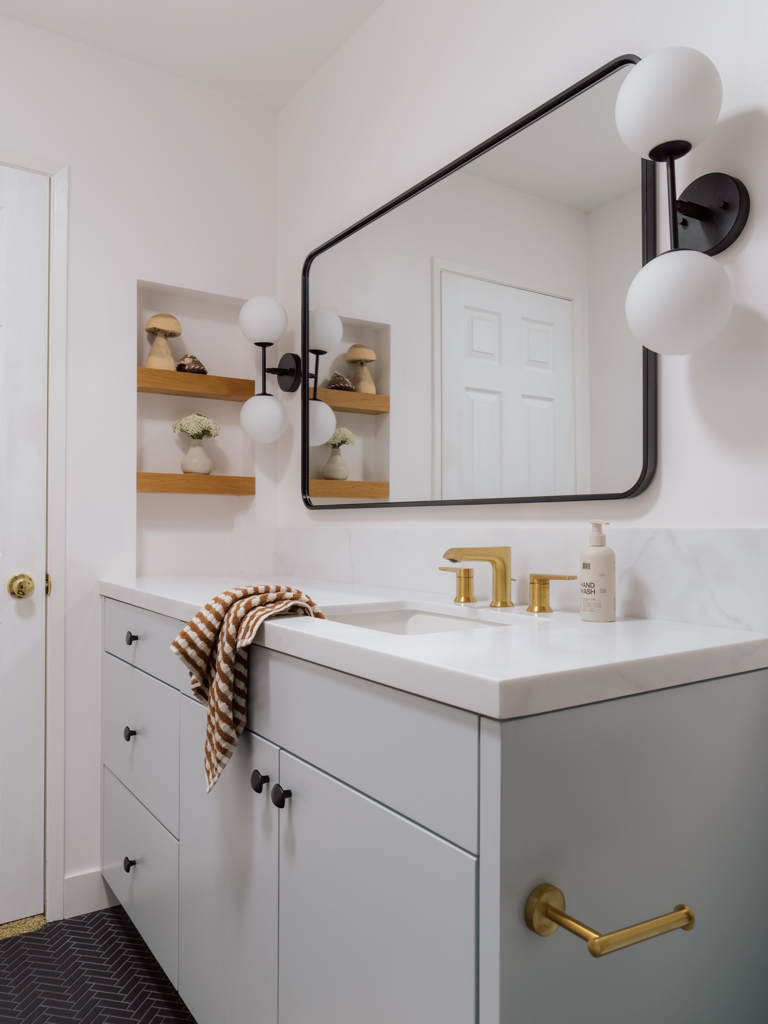 Before &amp; After ✨

A shared kids&rsquo; bathroom designed to grow with them: from childhood through their teen years.

We added light blue custom cabinetry for a soft, timeless look, removed the outdated medicine cabinet, and chose open storage so