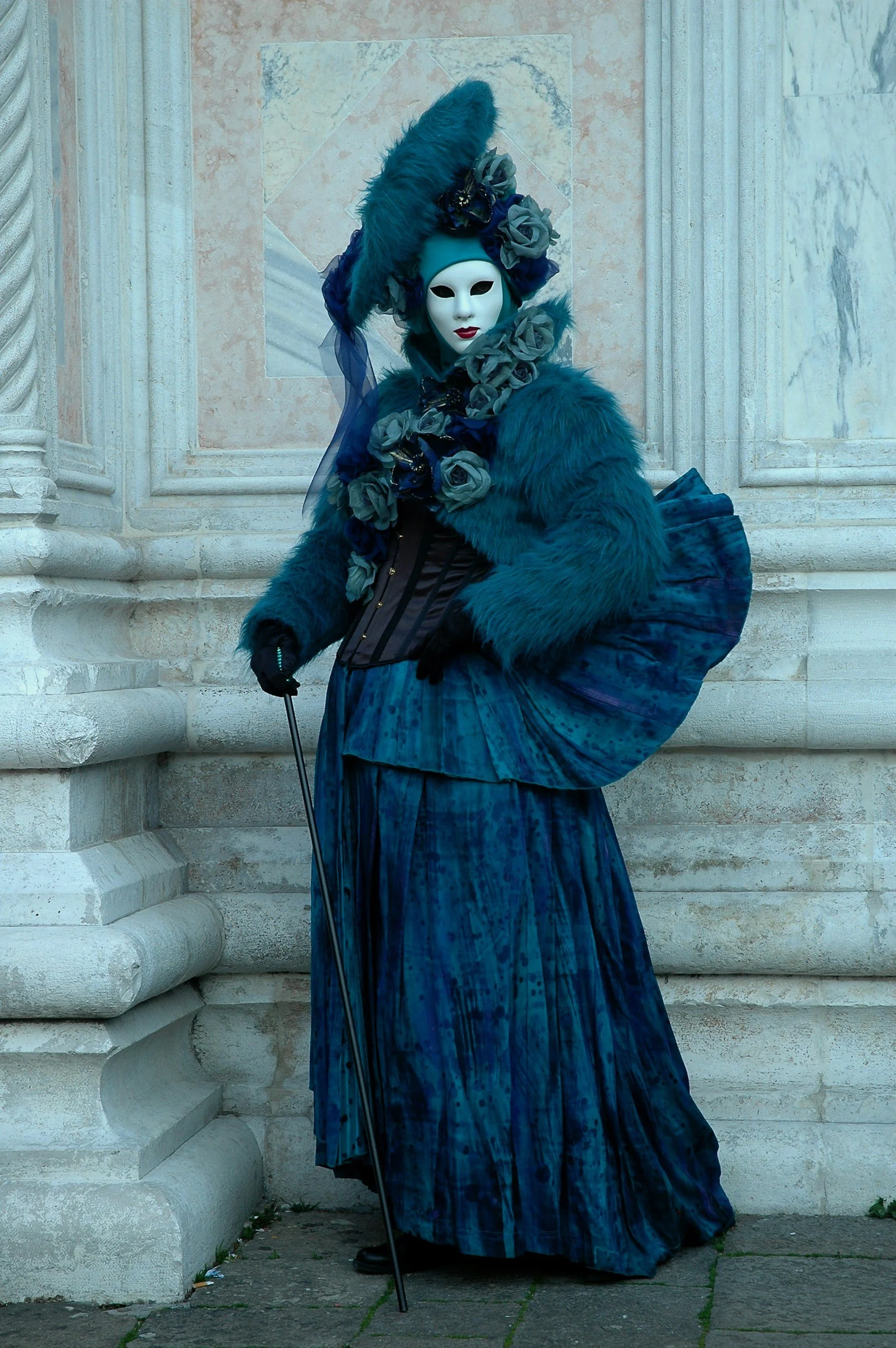 A person in a blue-colored victorian dress.