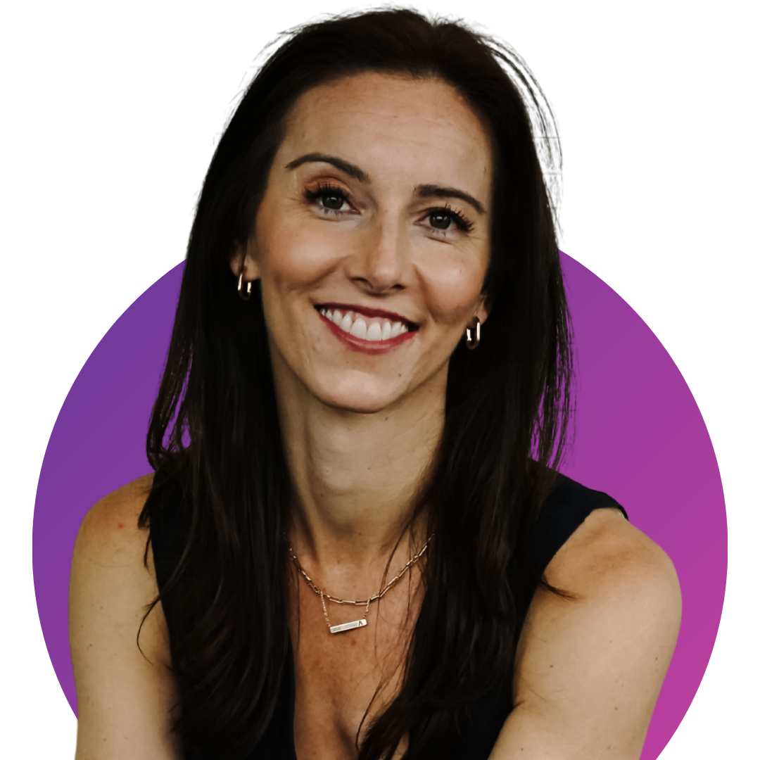 Amanda Hinman sitting on a couch and smiling in a headshot portrait