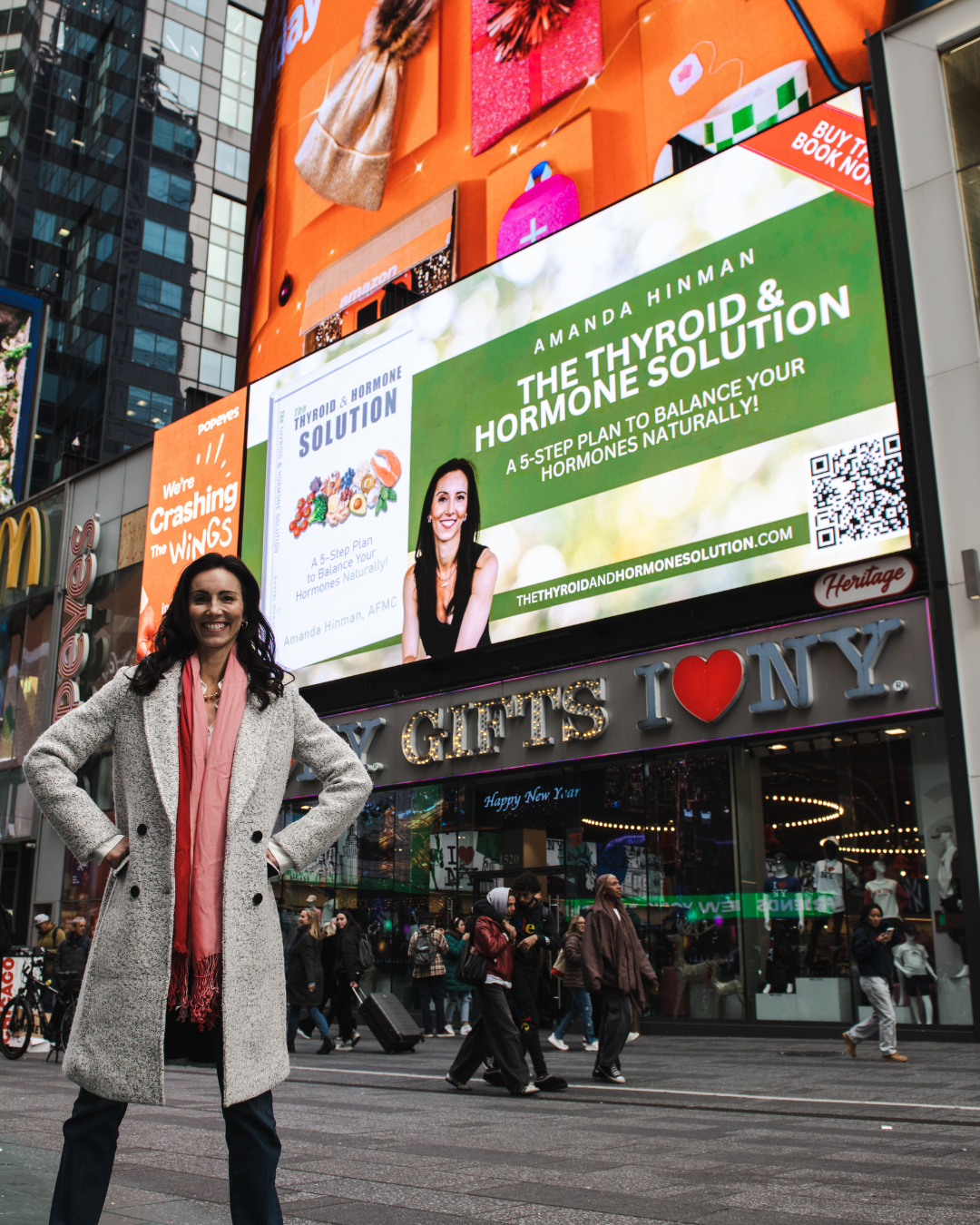 Amanda Hinman’s book displayed on a billboard in New York Times Square